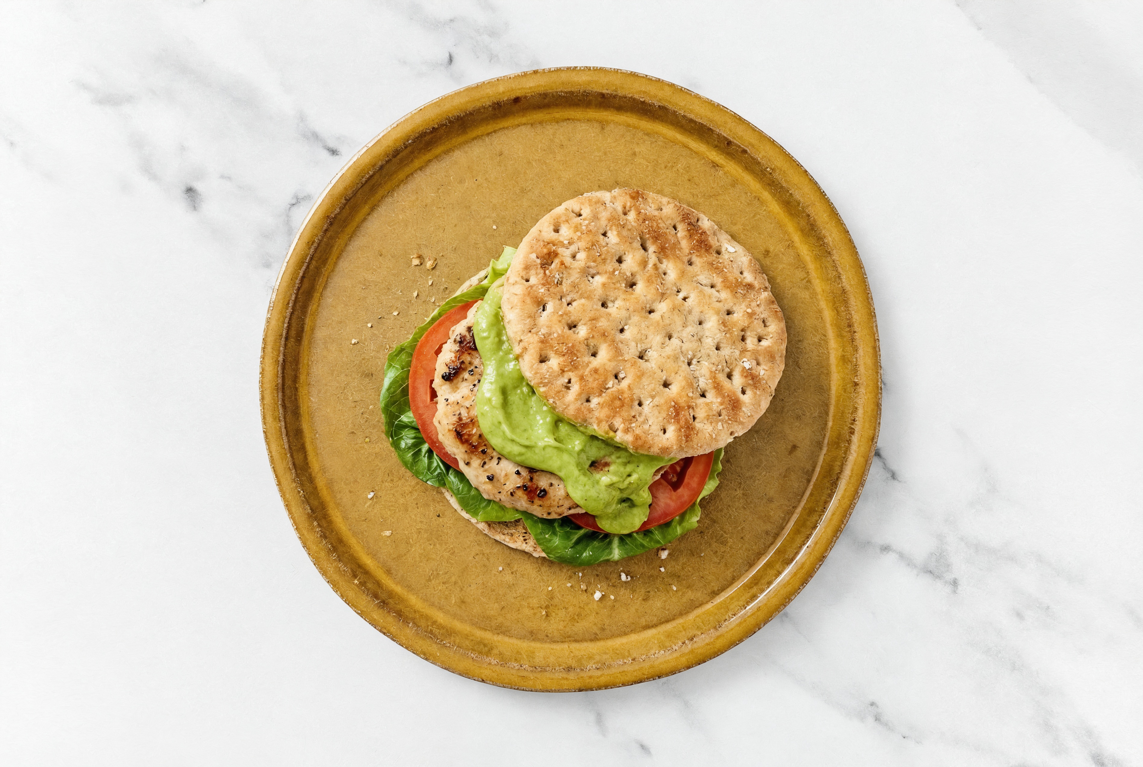 Deluxe Avocado Chicken Bacon Burger on Multigrain