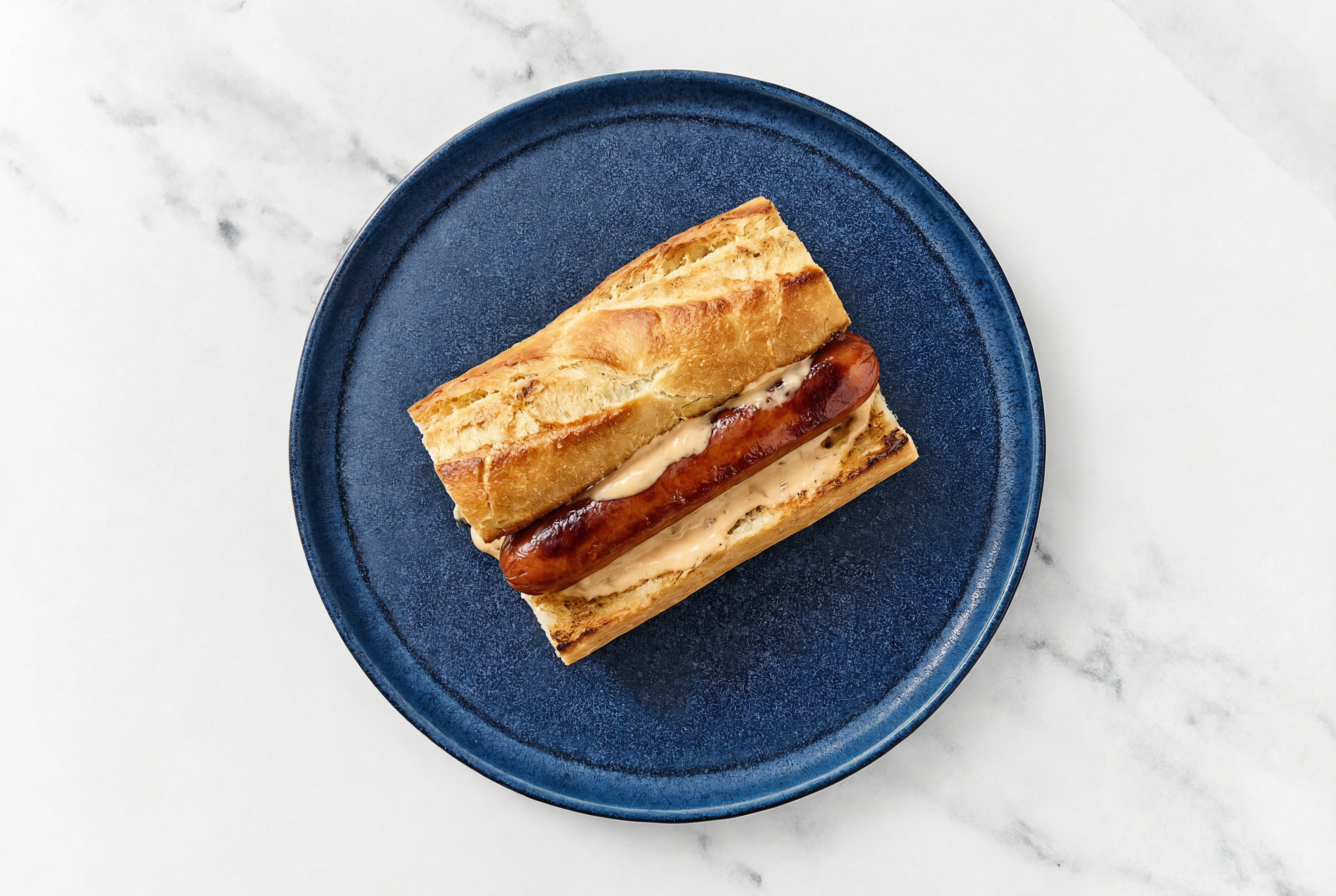 Beef Hot Dog with Awesome Sauce on Baguette