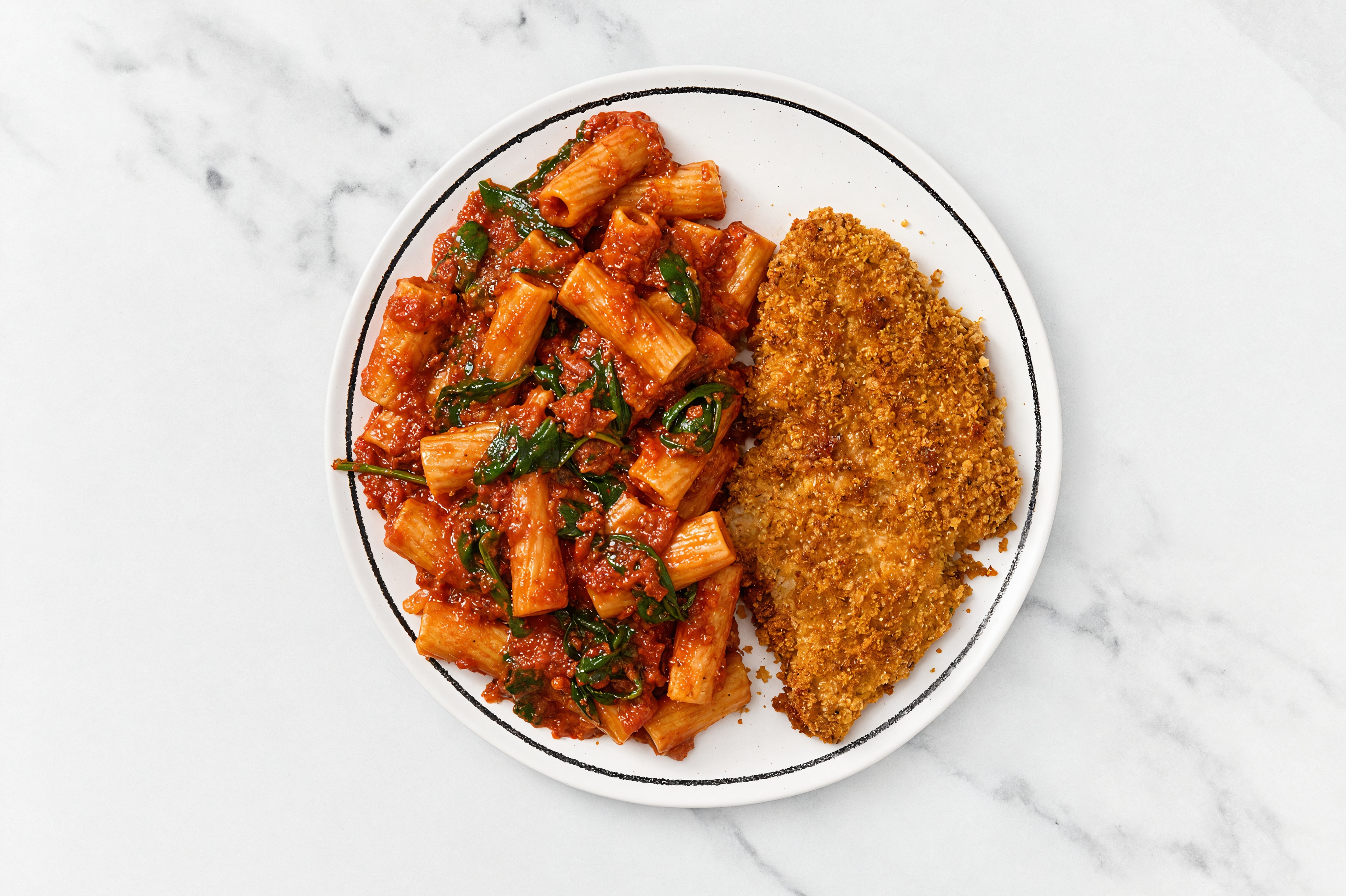 Crispy Hot Honey Chicken over Marinara Rigatoni with Baby Spinach
