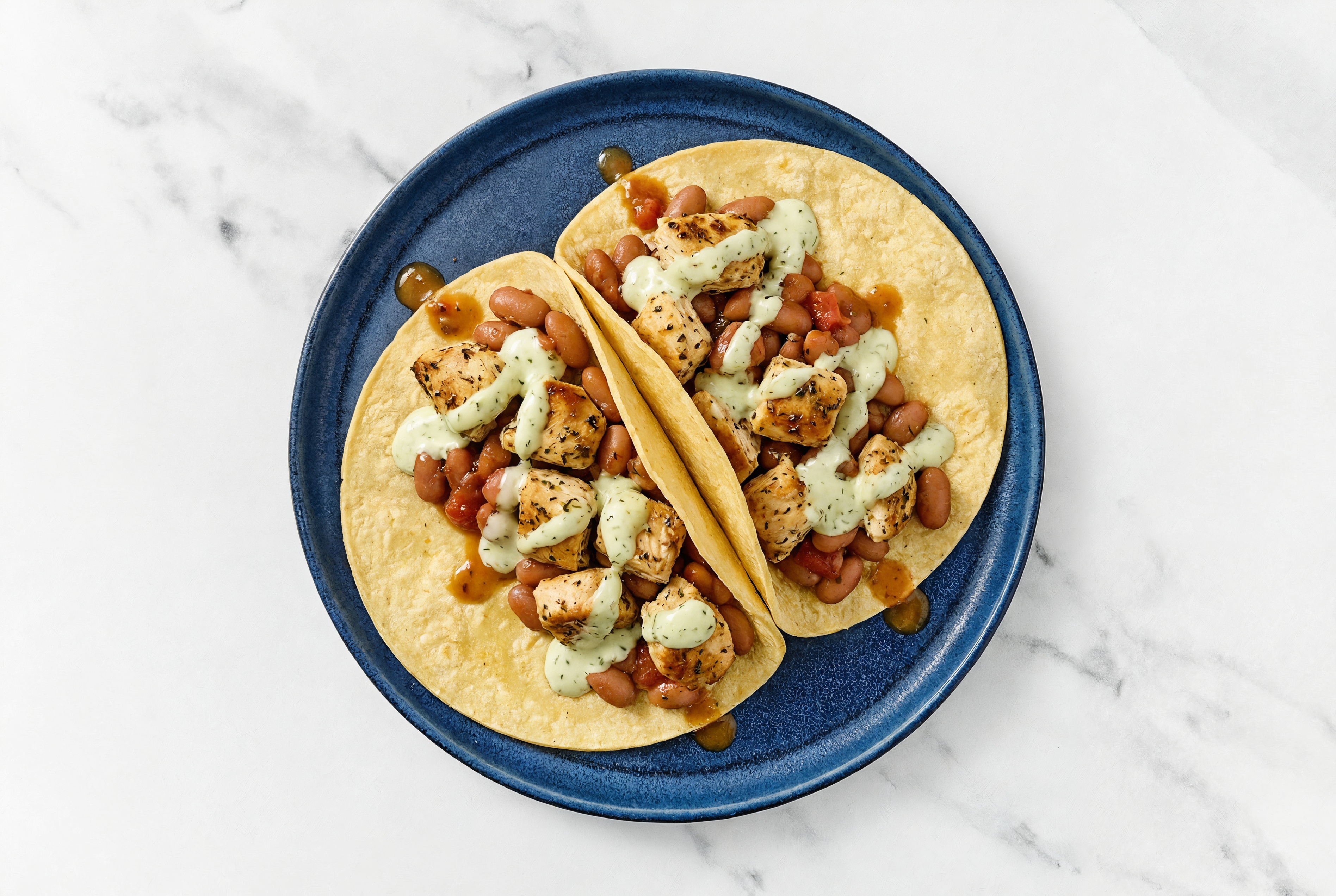 Herby Garlic Chicken Tacos with Jalapeño Crema & Pinto Beans