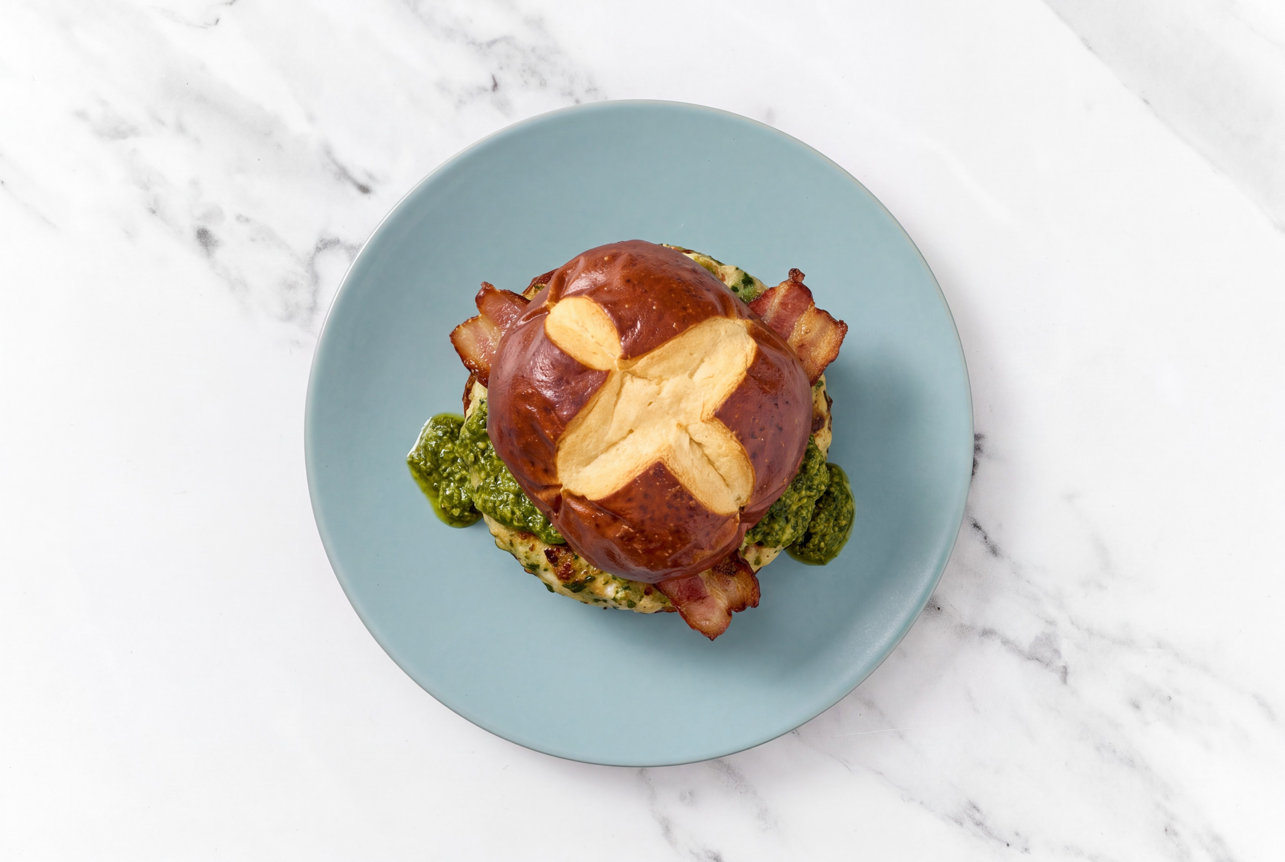 Garlic Turkey Burger on Pretzel with Spinach Pesto & Smoked Bacon