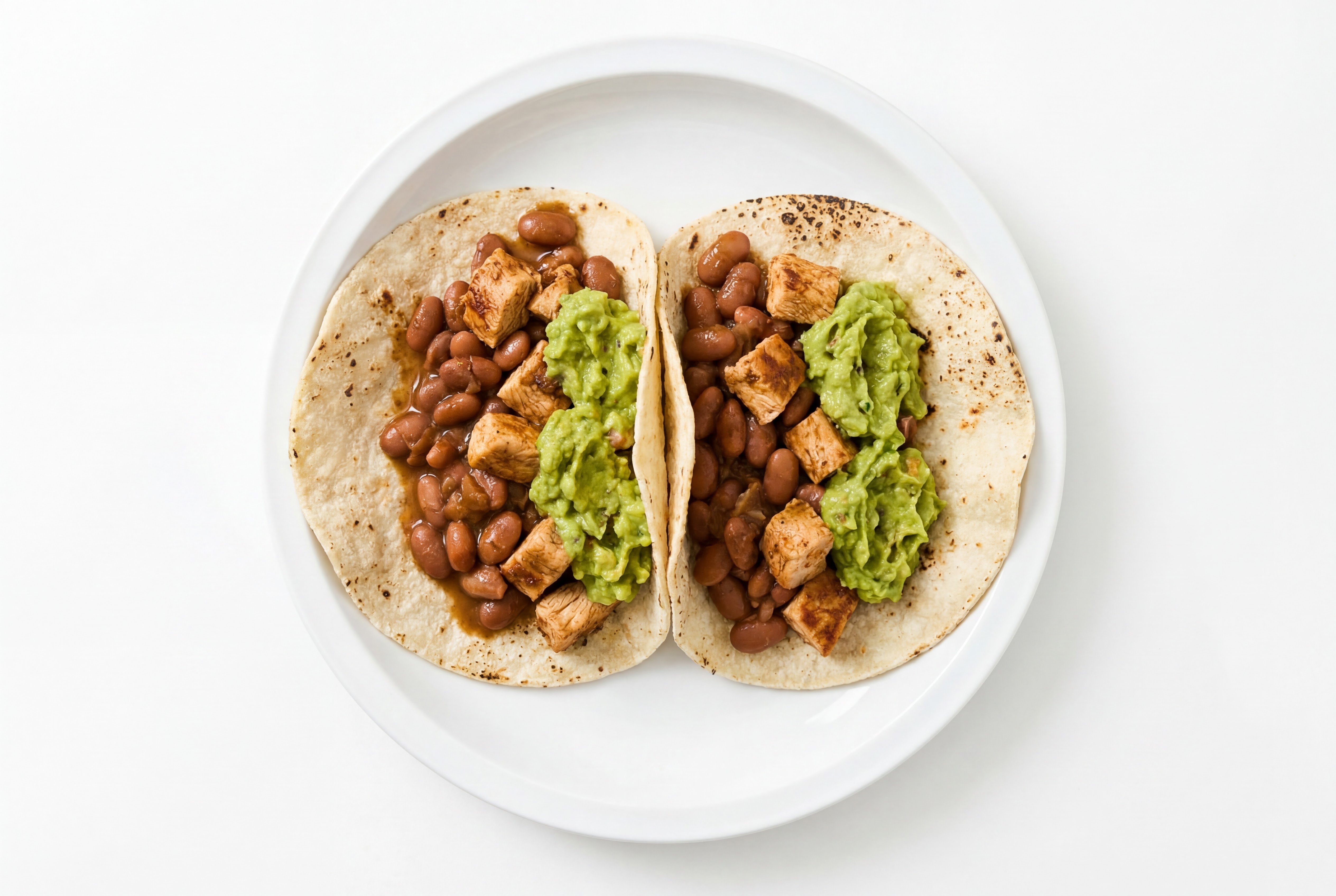 Hearty Chipotle Chicken Tacos with Guacamole & Pinto Beans