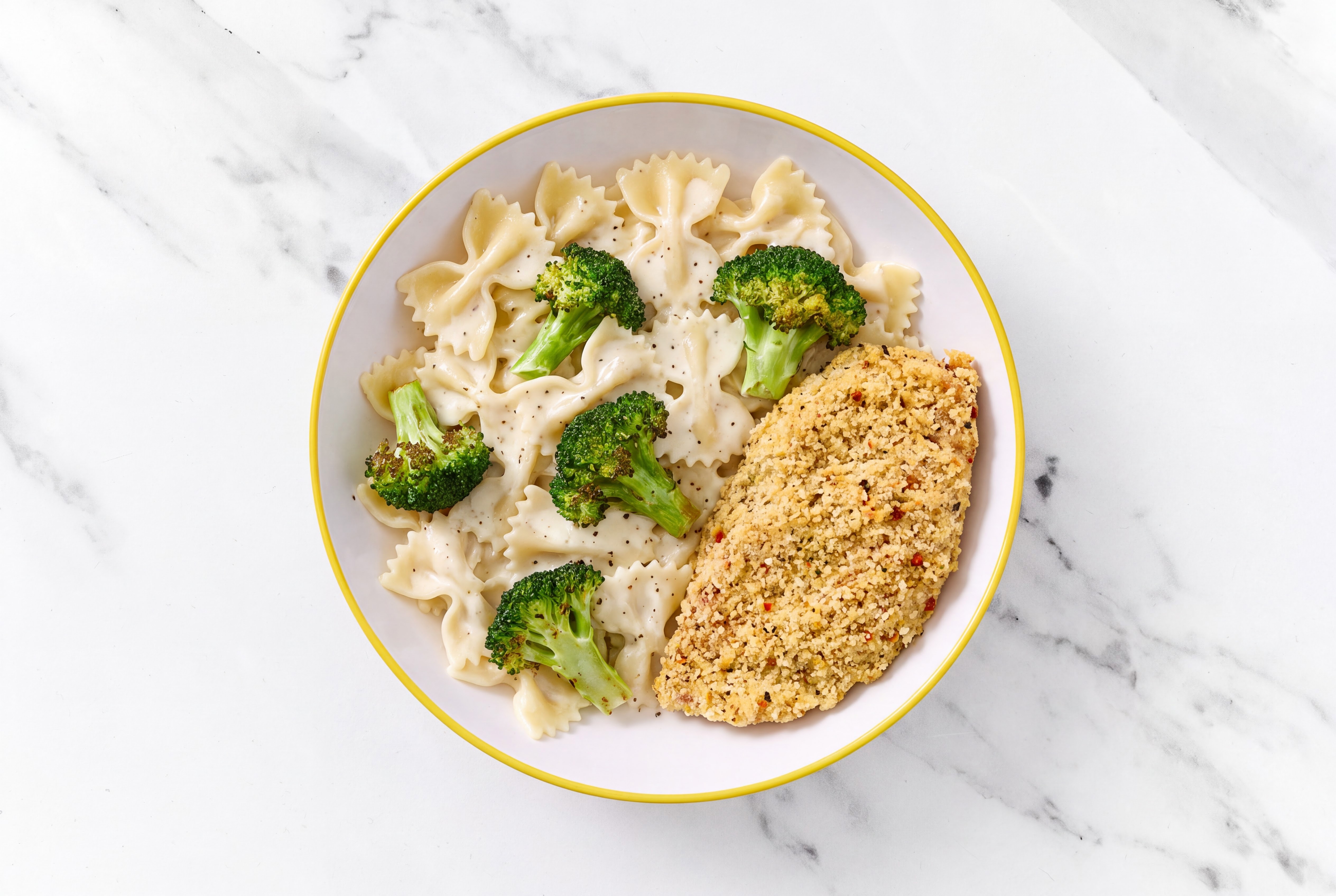 Crispy Garlic Chicken over Alfredo Farfalle with Broccoli