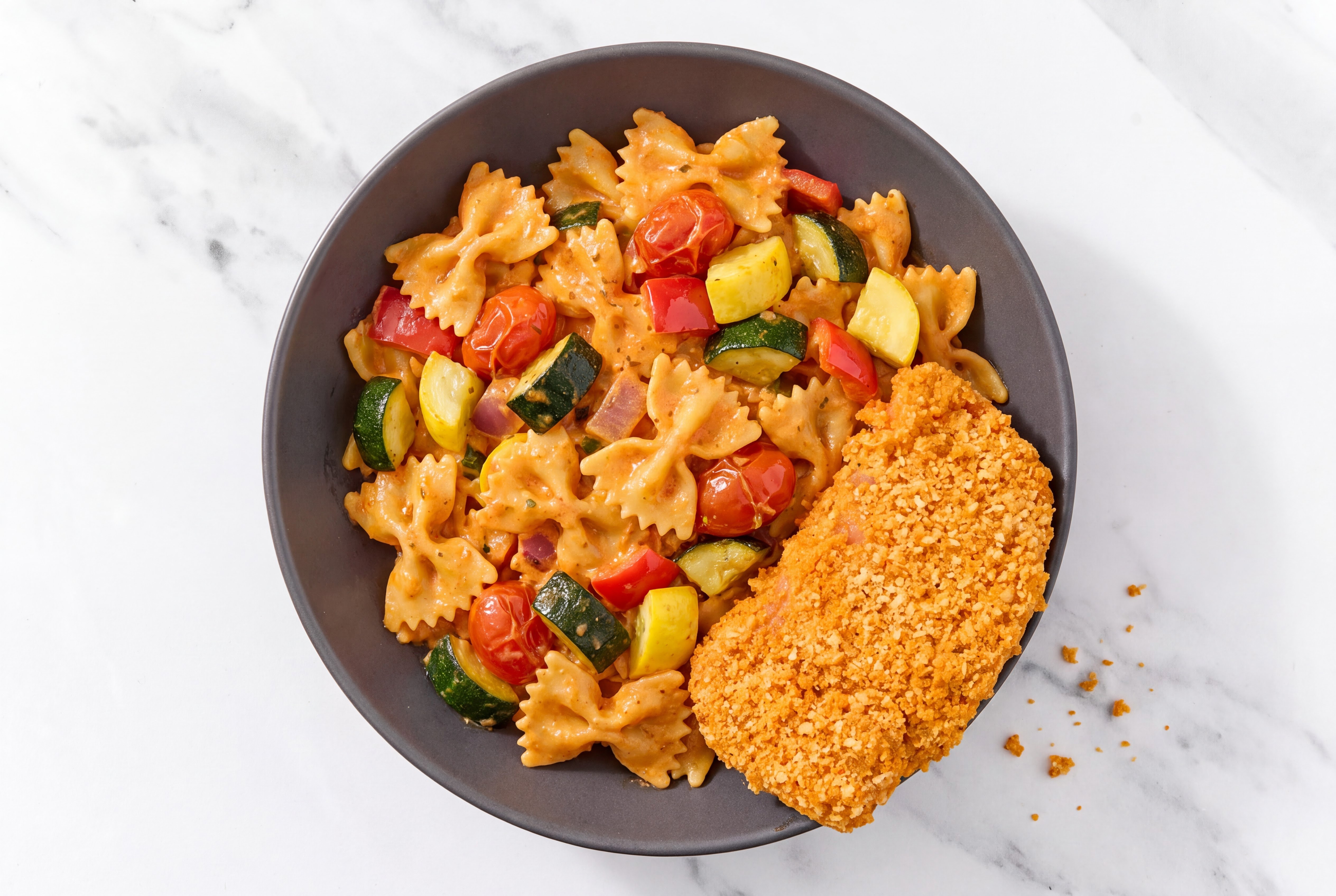 Crispy Hot Honey Chicken over Creamy Vodka Farfalle with Mixed Veggies