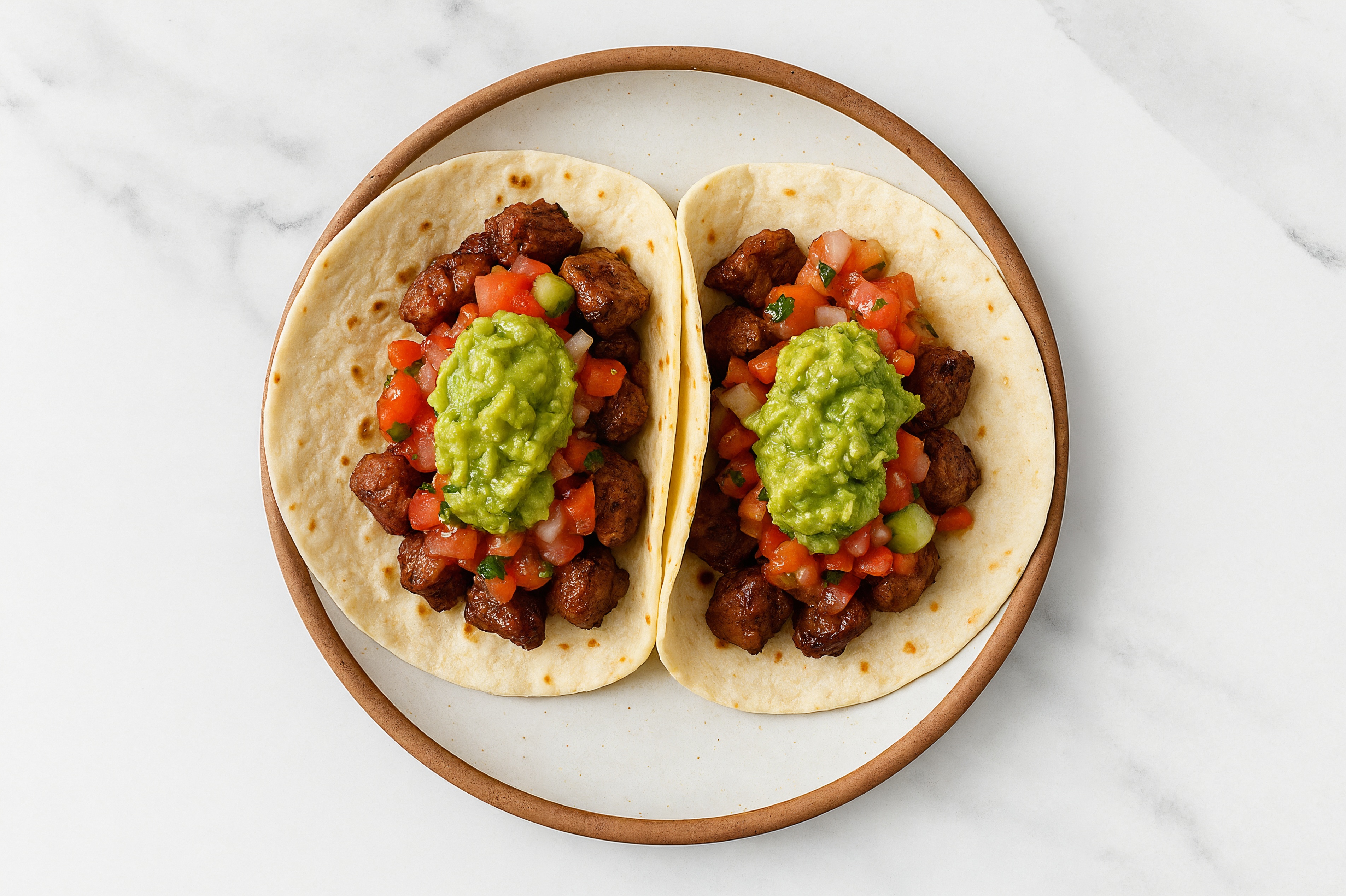 Savory Blackened Bison + Guacamole Tacos