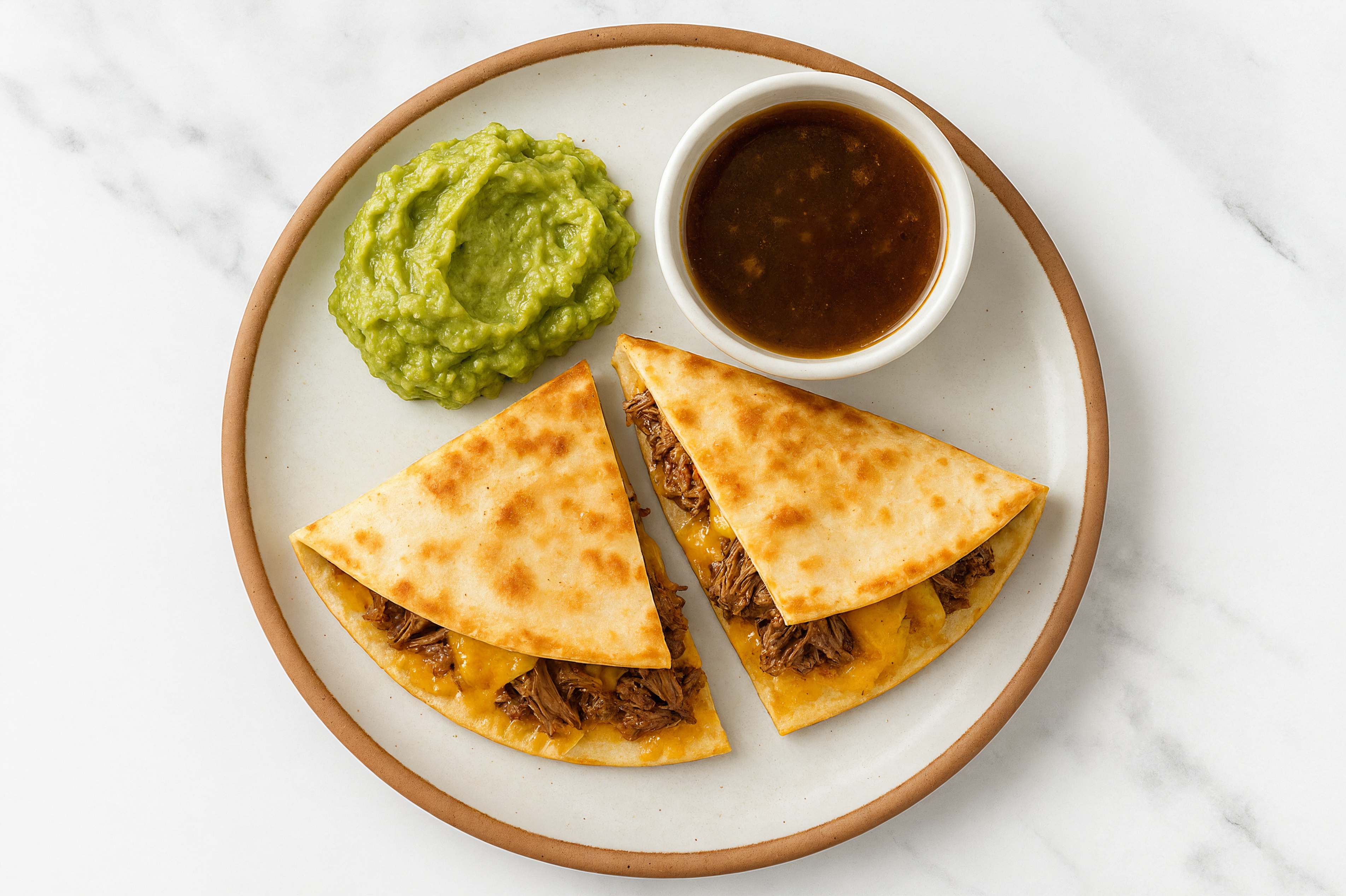 Birria Style Taco with Guacamole with Shredded Sharp Cheddar Cheese