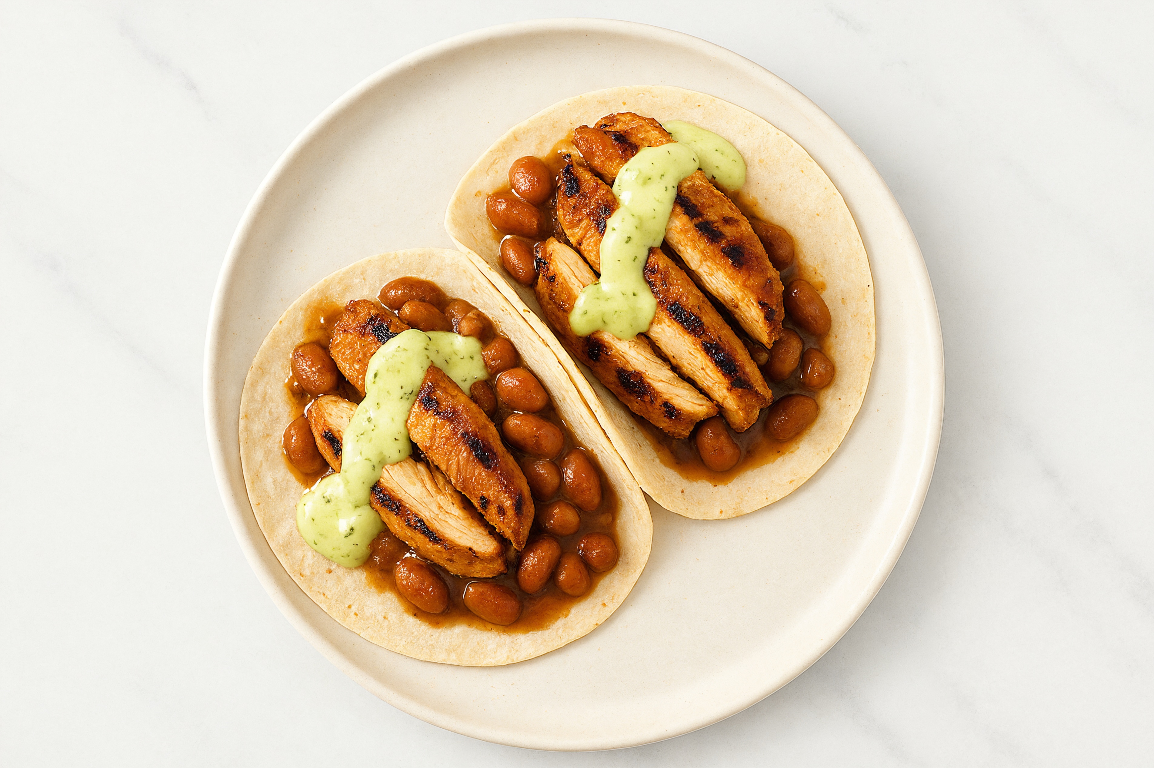 Blackened Chicken Tacos with Jalapeño Crema & Pinto Beans