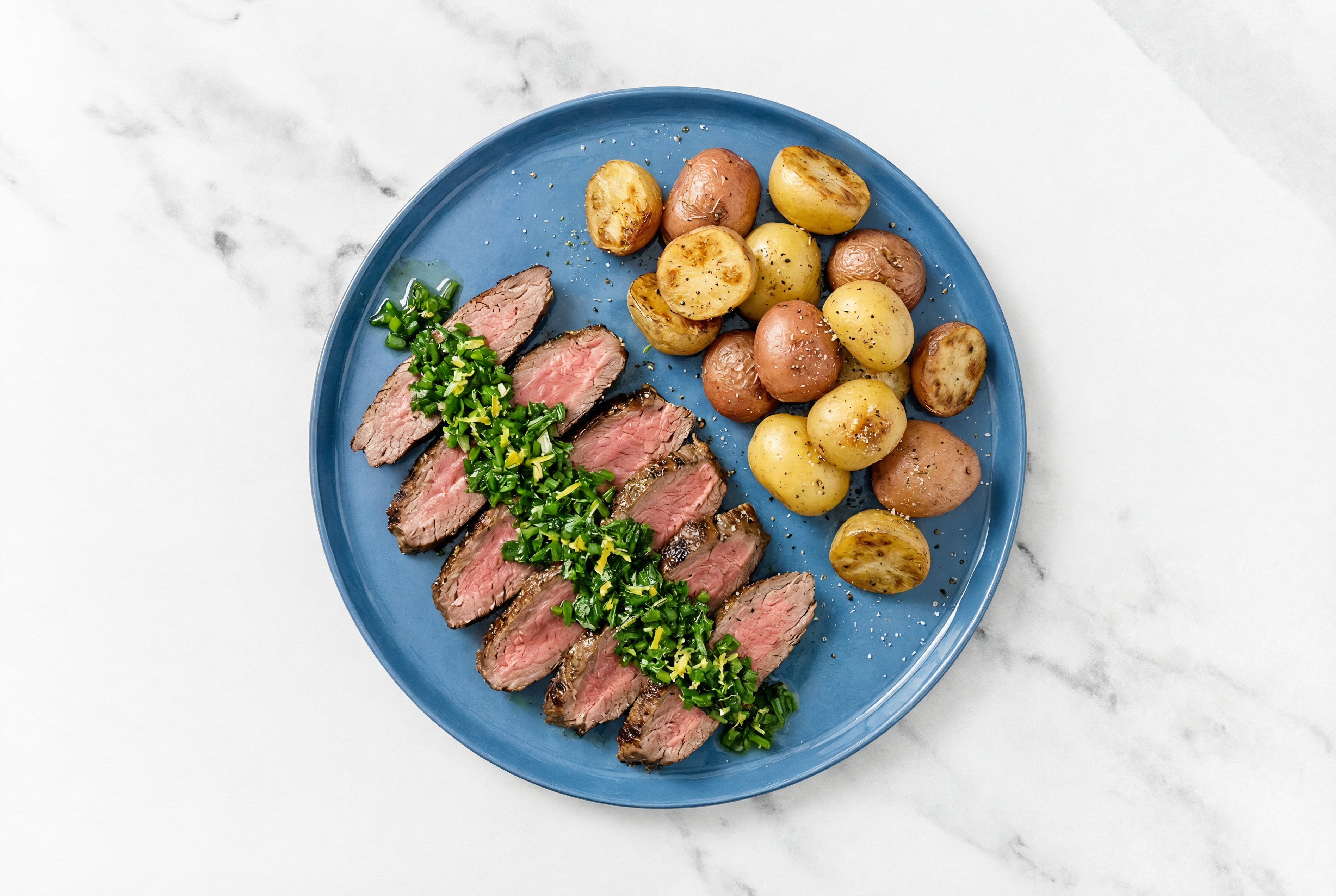 Rosemary Garlic Beef Flank Steak + Potatoes with Herby Salsa Verde