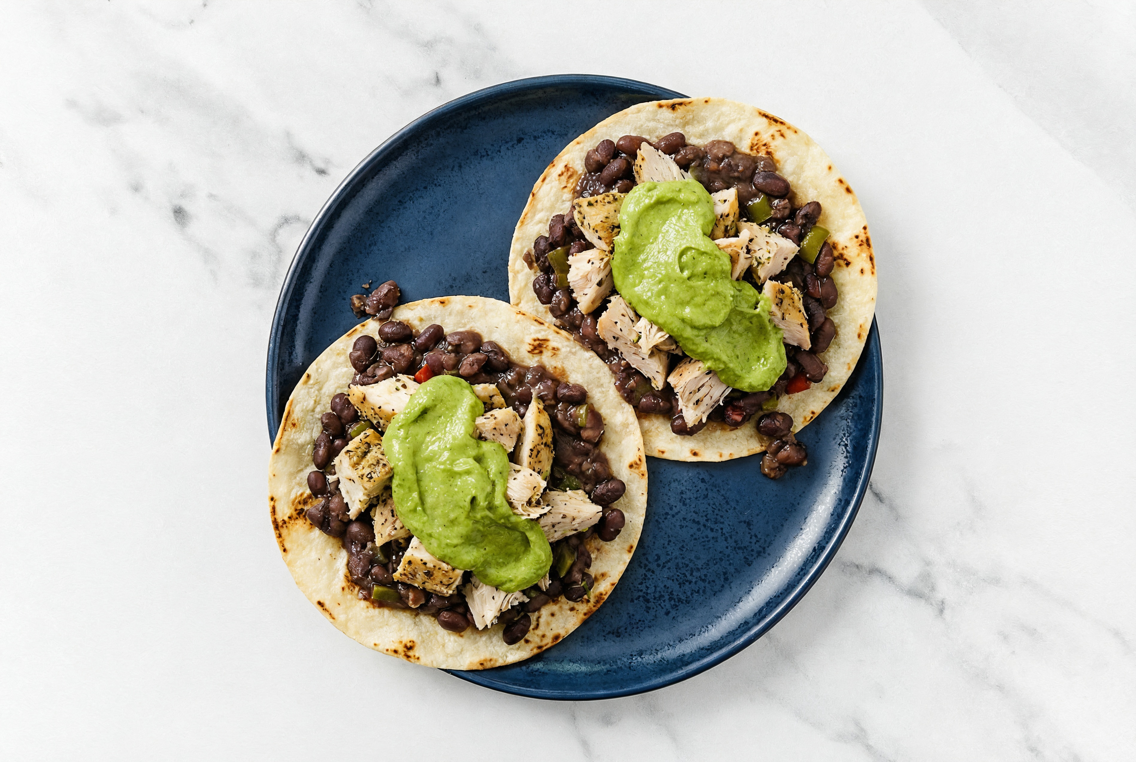 Cuban Black Bean + Lemon Pepper Chicken Tostada