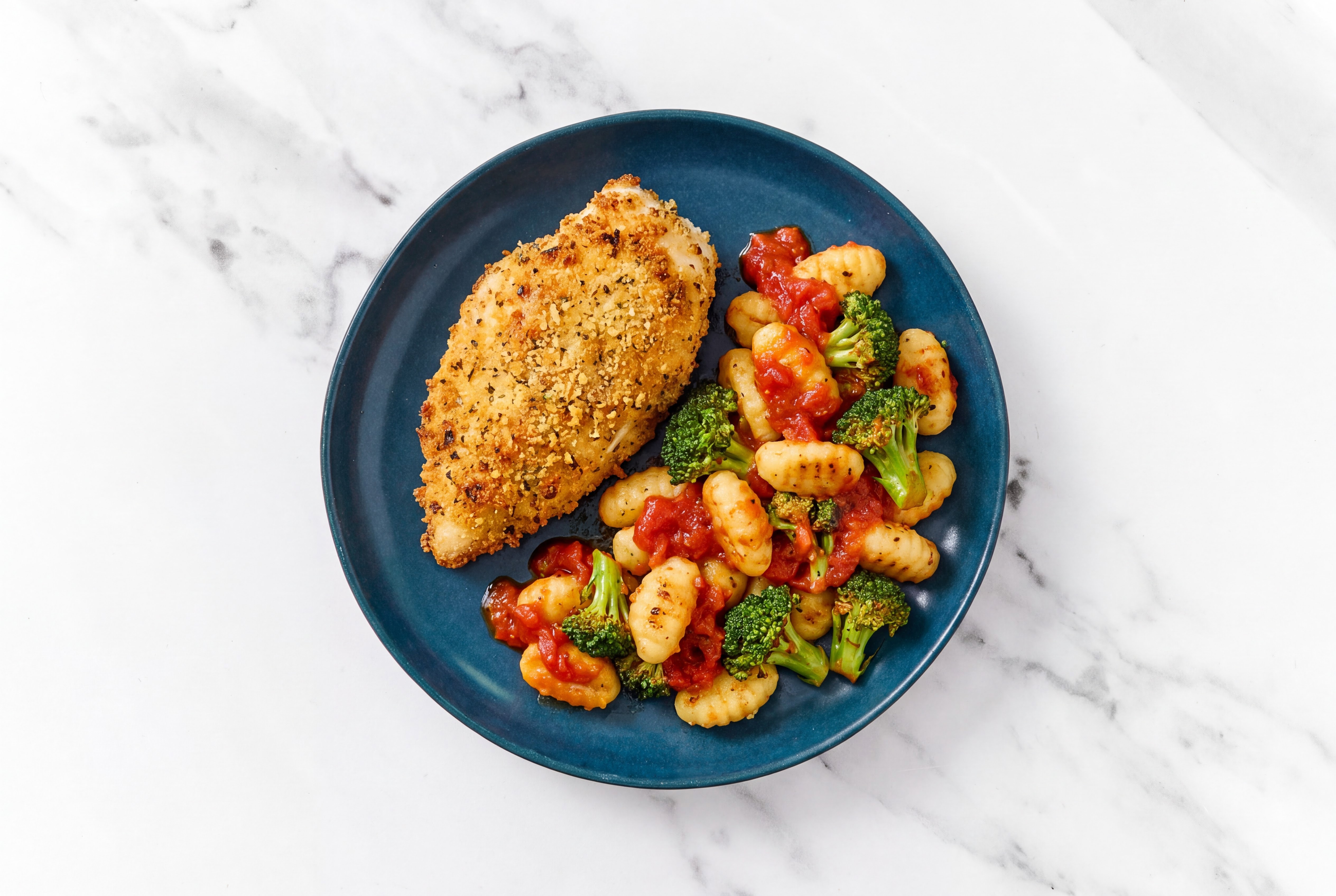 Crispy Garlic Chicken over Marinara Gnocchi with Broccoli