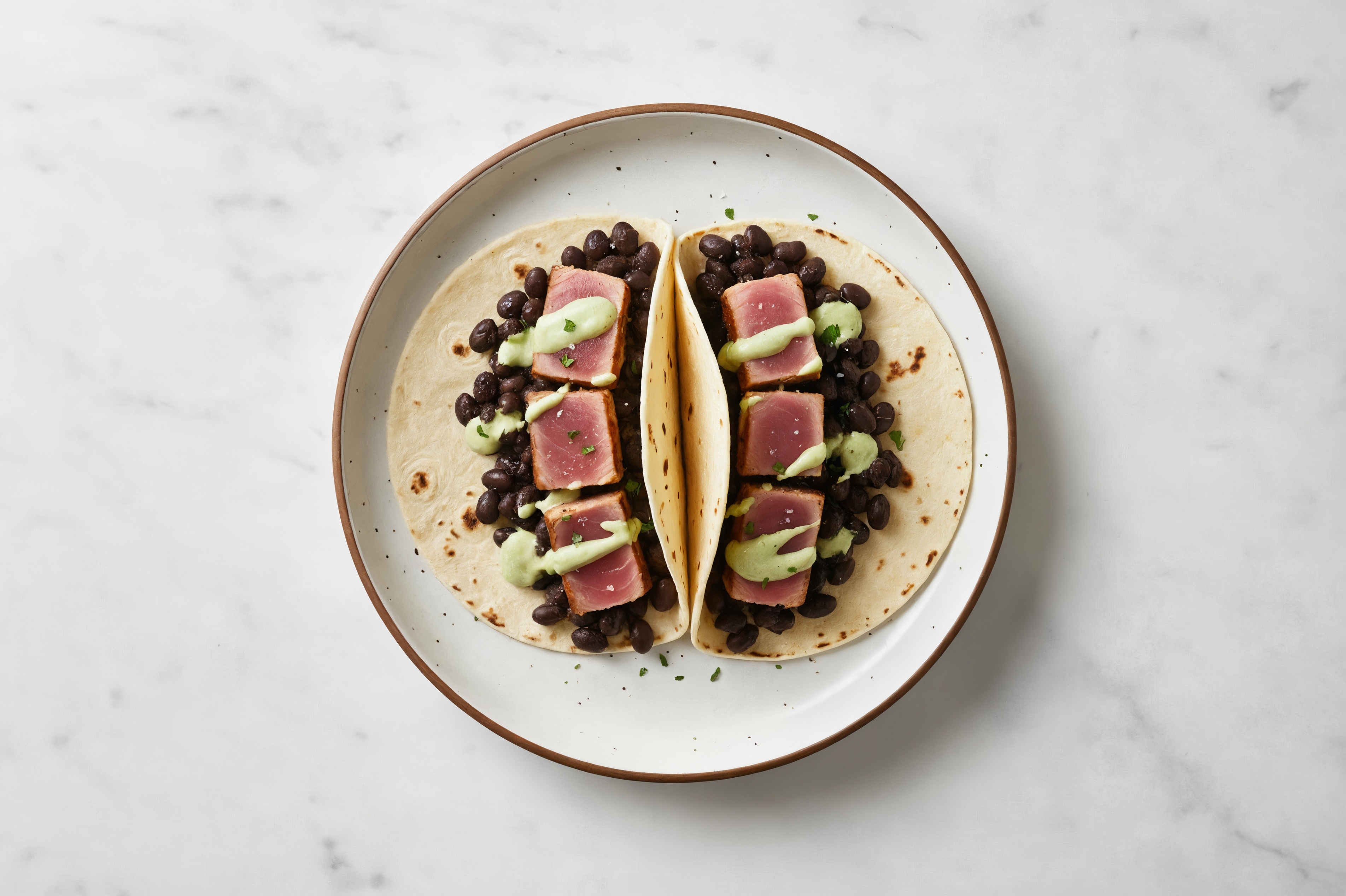 Hearty Cuban Spiced Black Beans Bean Tacos with Seared Tuna & Jalapeño Crema