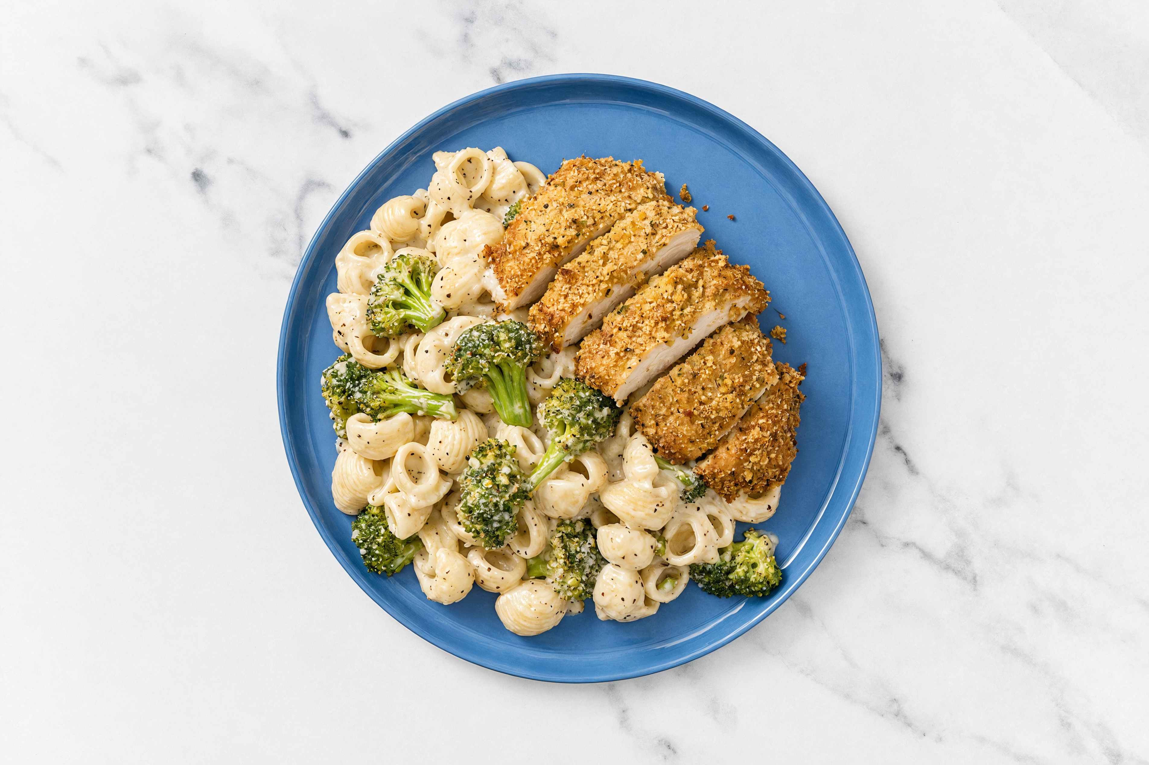 Crispy Garlic Chicken over Alfredo Chiocciole Pasta with Broccoli
