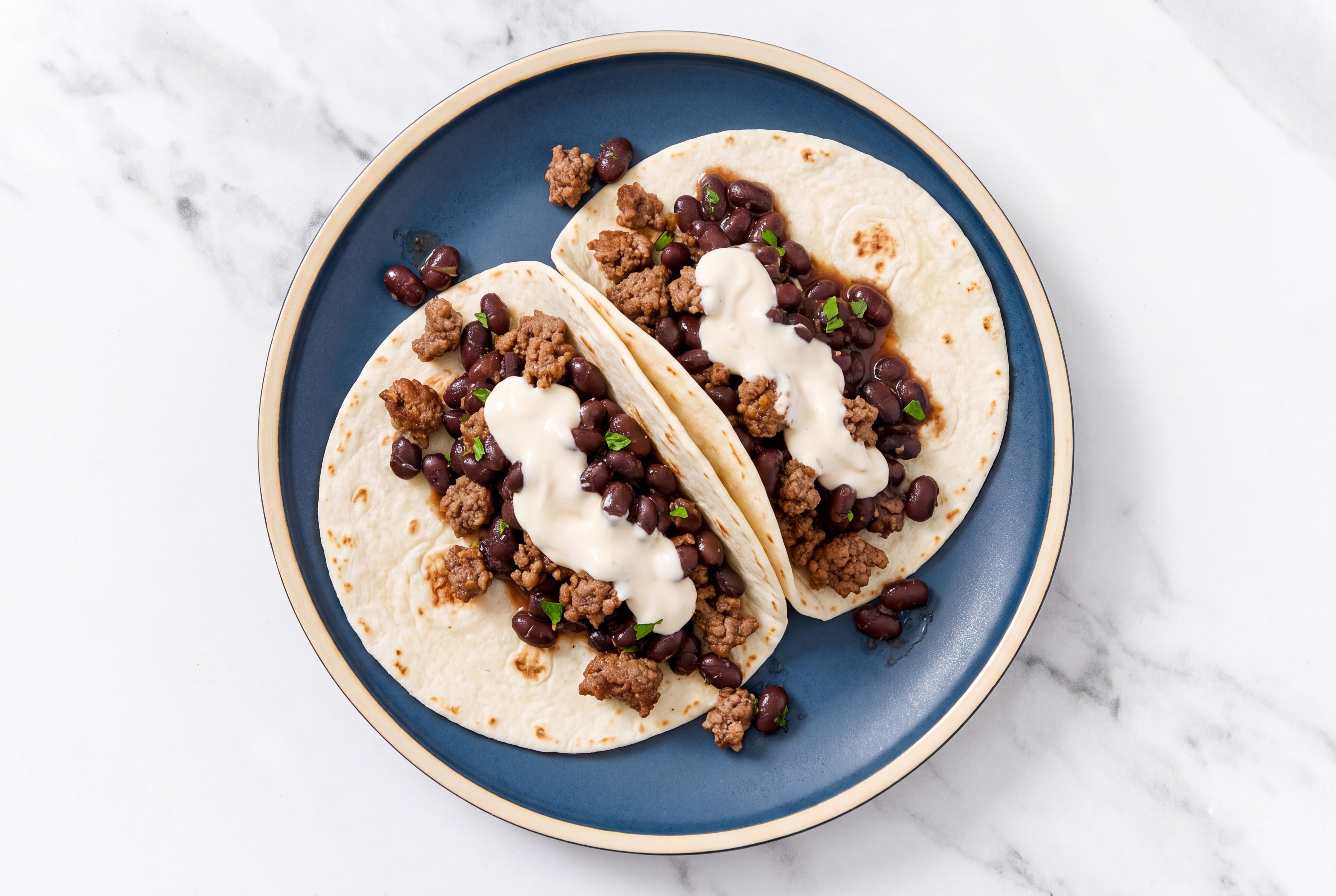 Ground 93/7 Lean Beef Tacos with Crema & Spiced Beans