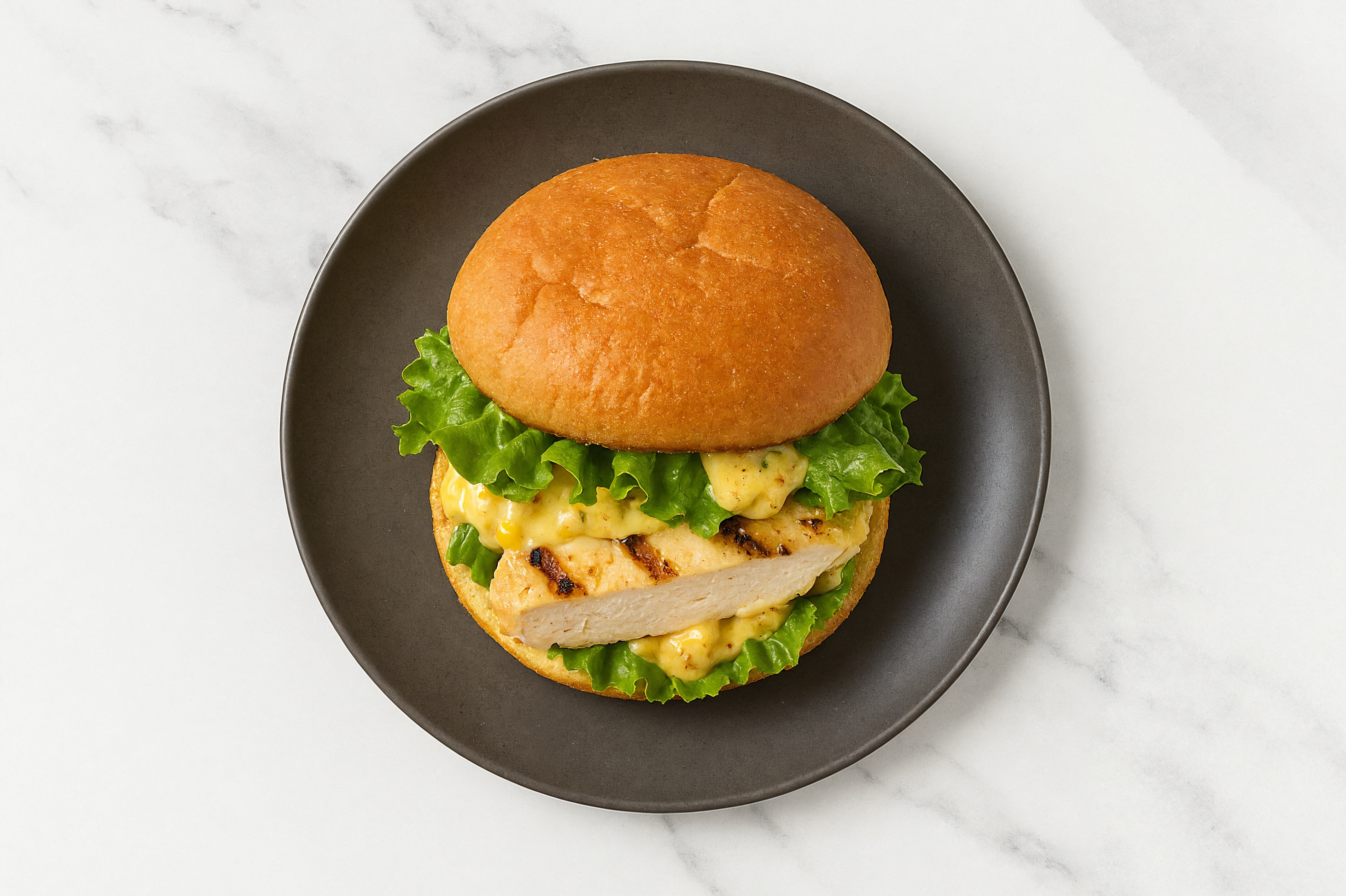 Street Corn Grilled Chicken Sandwich with Green Leaf Lettuce on Gluten-Free Buns