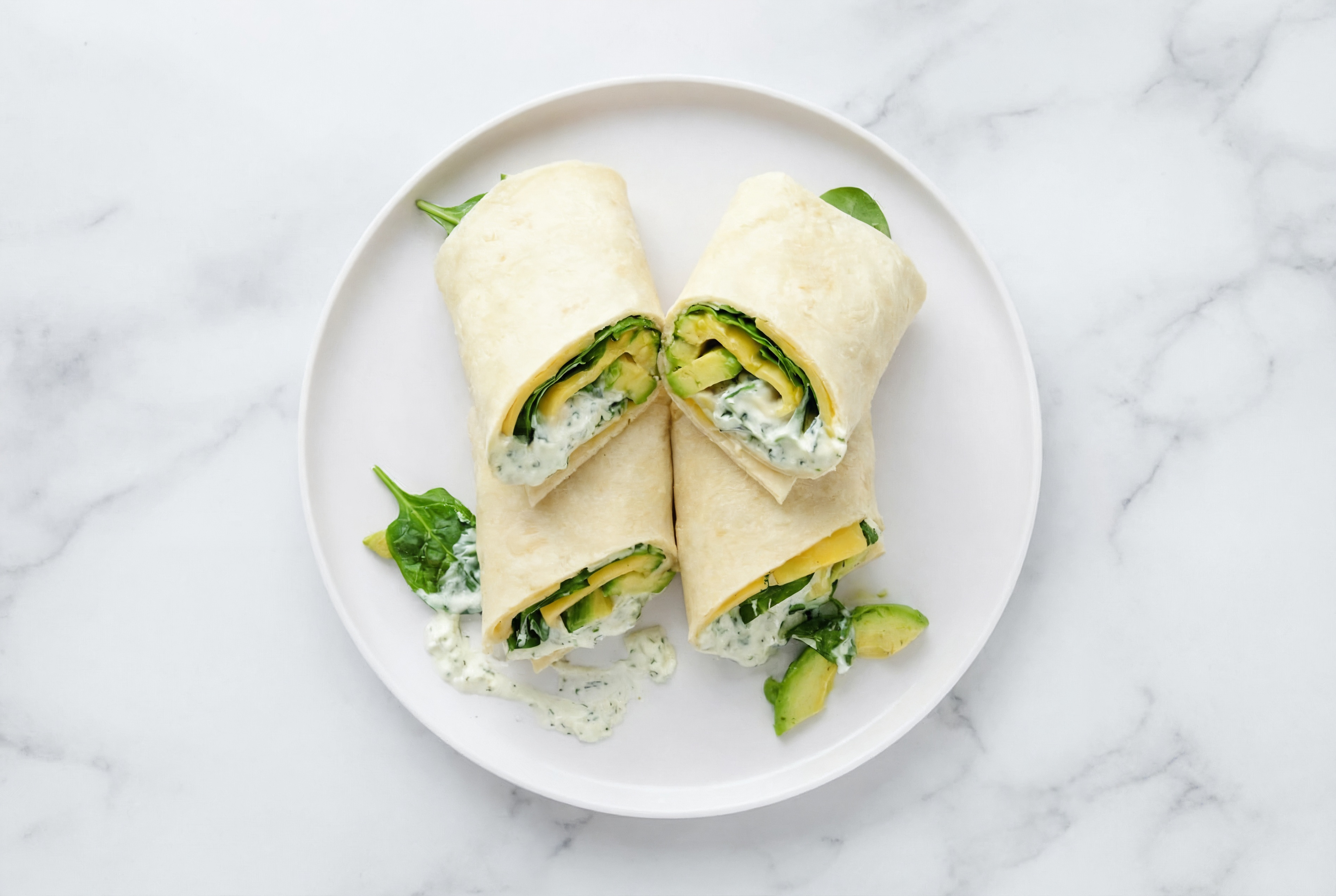 Creamy Avocado + Vegan Cheddar Wraps with Spinach