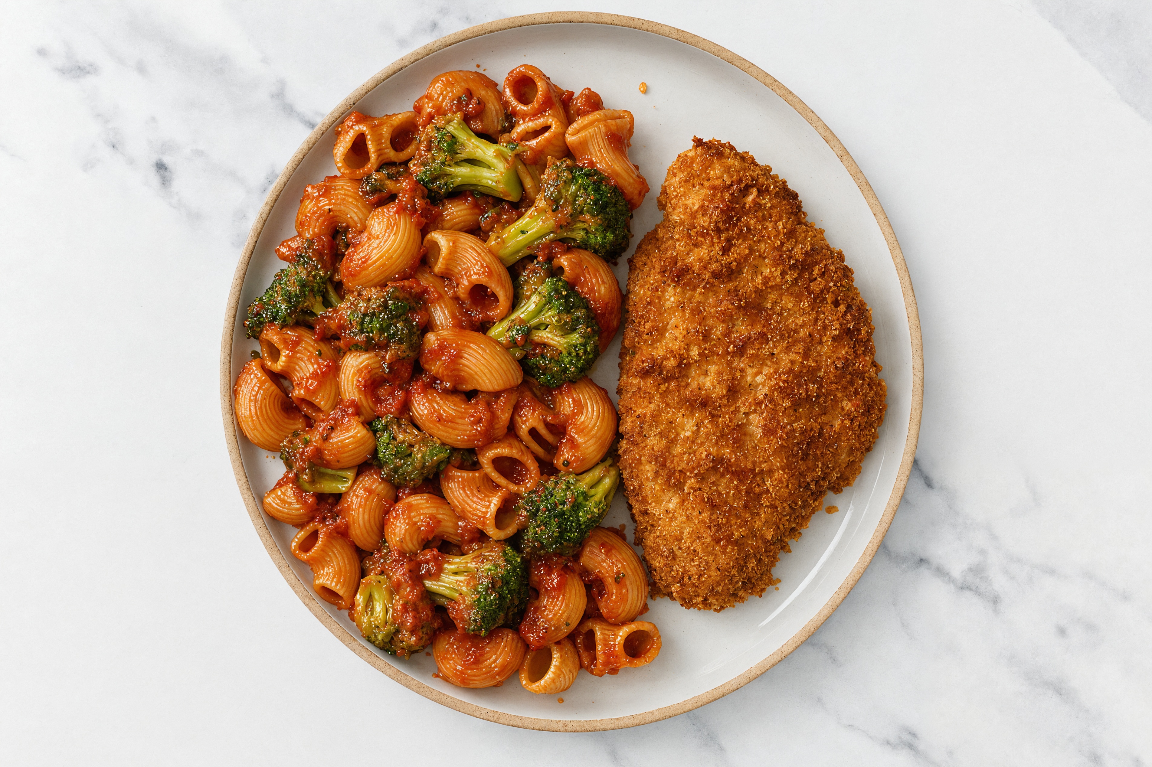 Crispy Hot Honey Chicken over Marinara Chiocciole Pasta with Broccoli