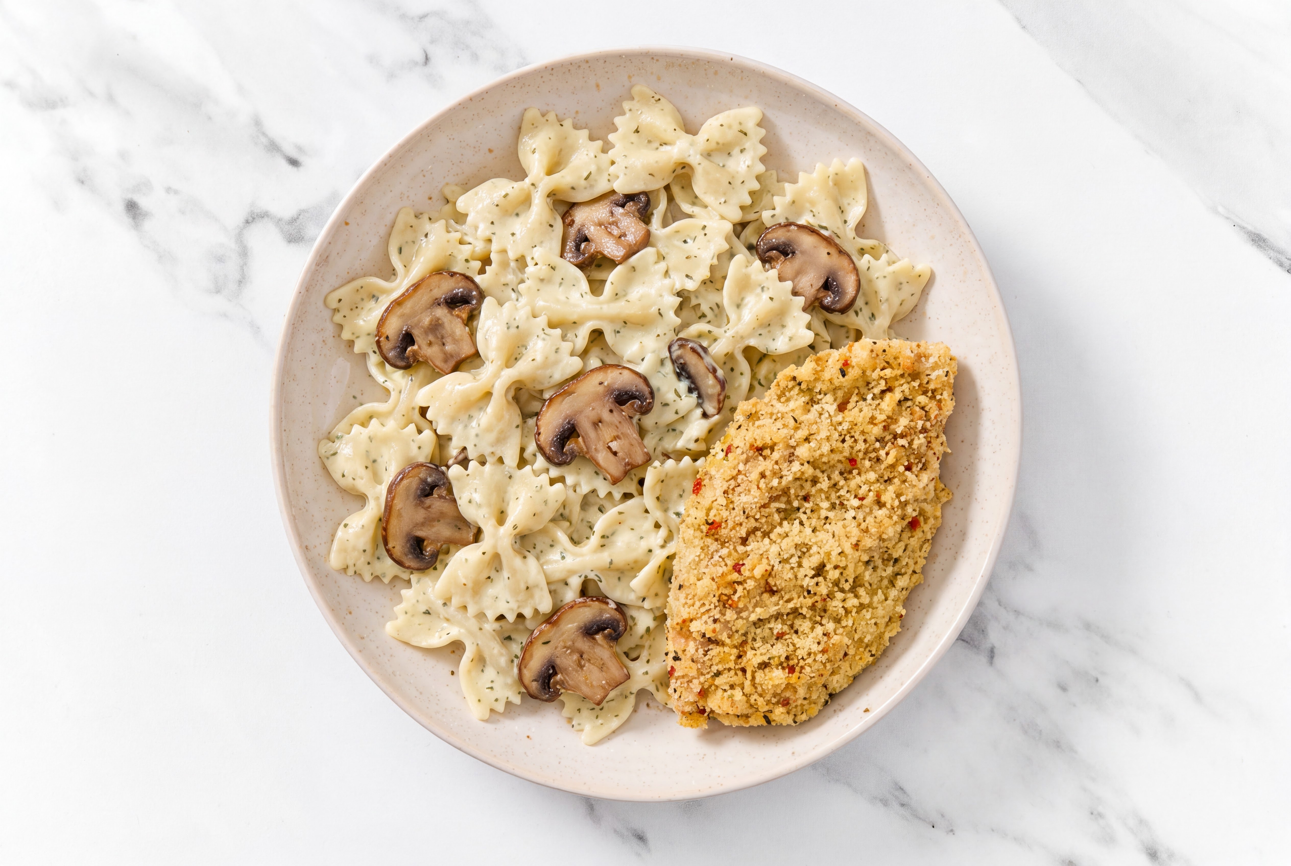 Crispy Garlic Chicken over Creamy Farfalle with Baby Bella Mushrooms