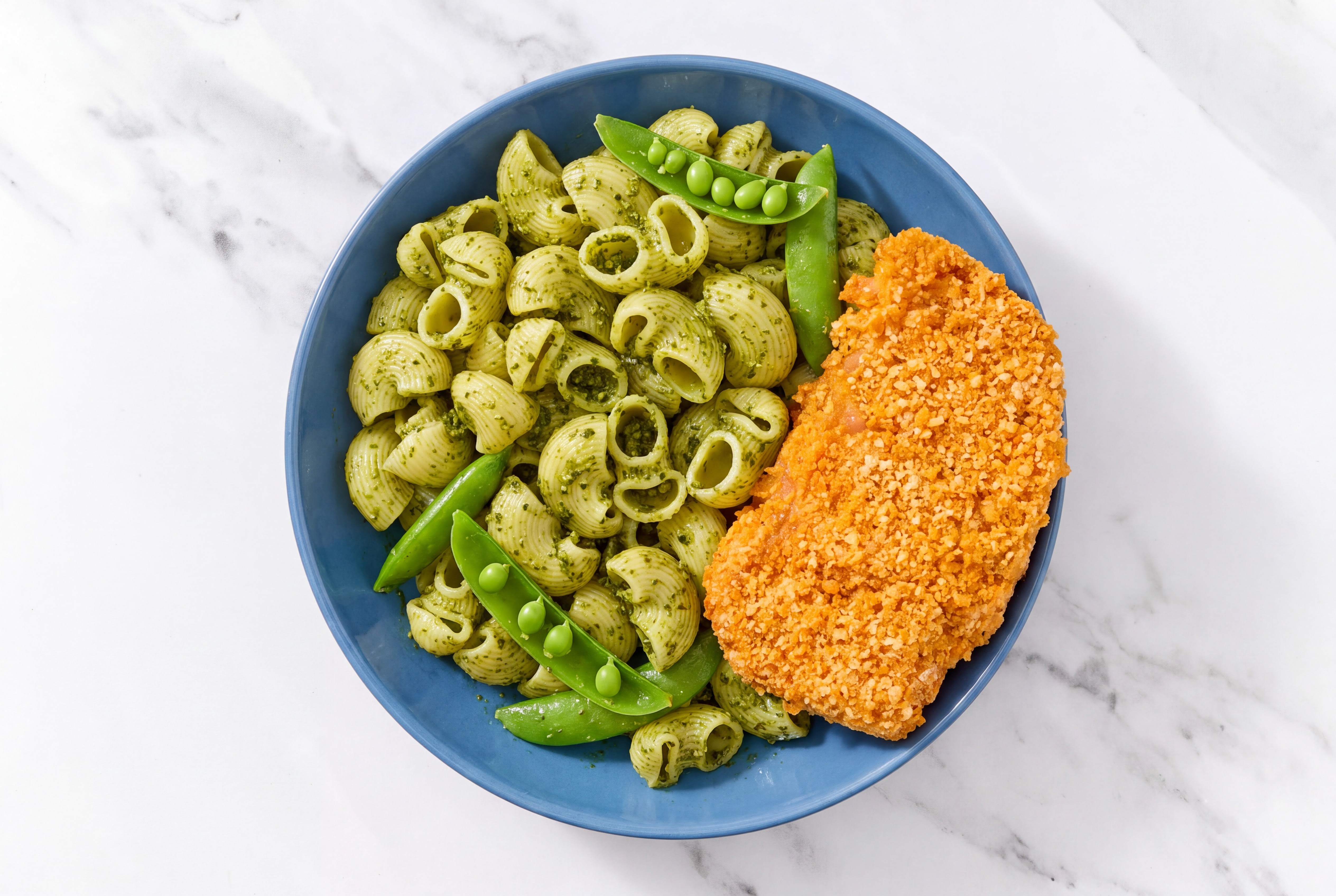 Crispy Hot Honey Chicken over Pesto Chiocciole Pasta with Snap Peas