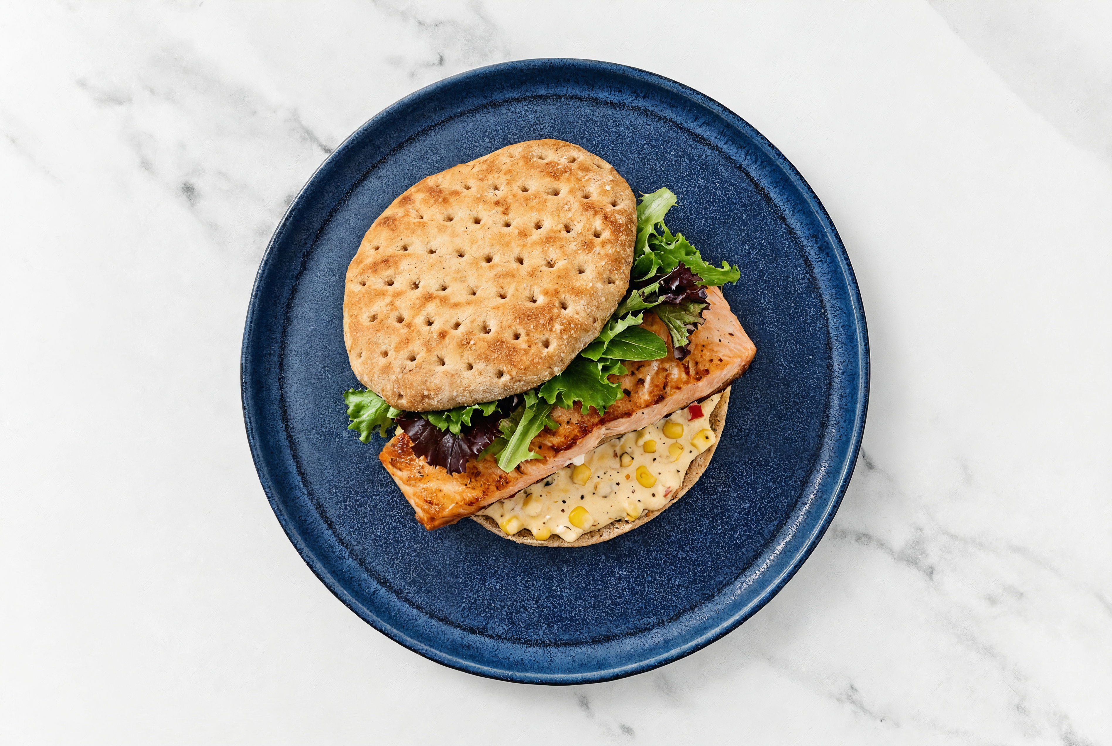 Street Corn Salmon Sandwich on Multigrain with Spring Mix