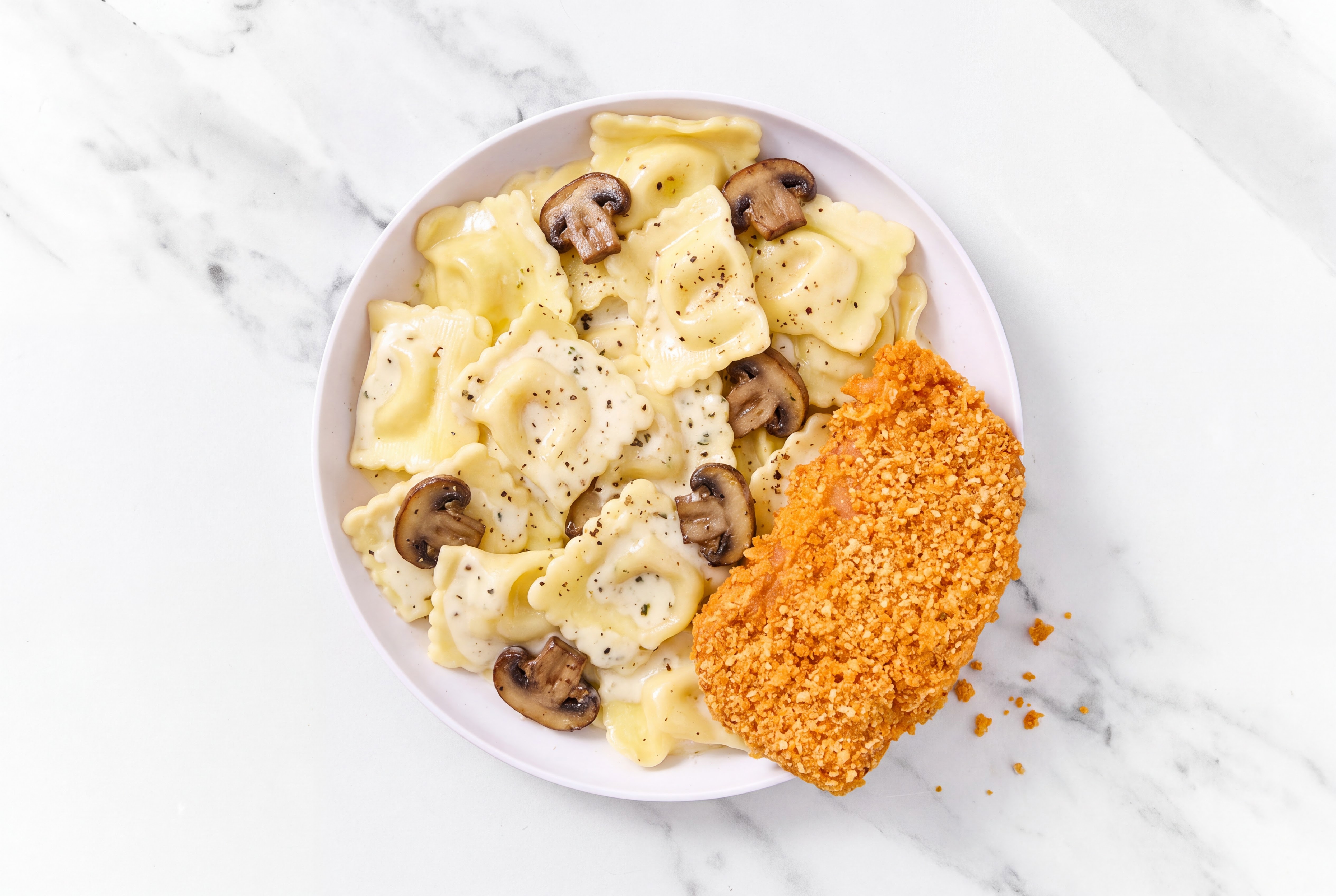 Crispy Hot Honey Chicken over Creamy Ravioli with Baby Bella Mushrooms