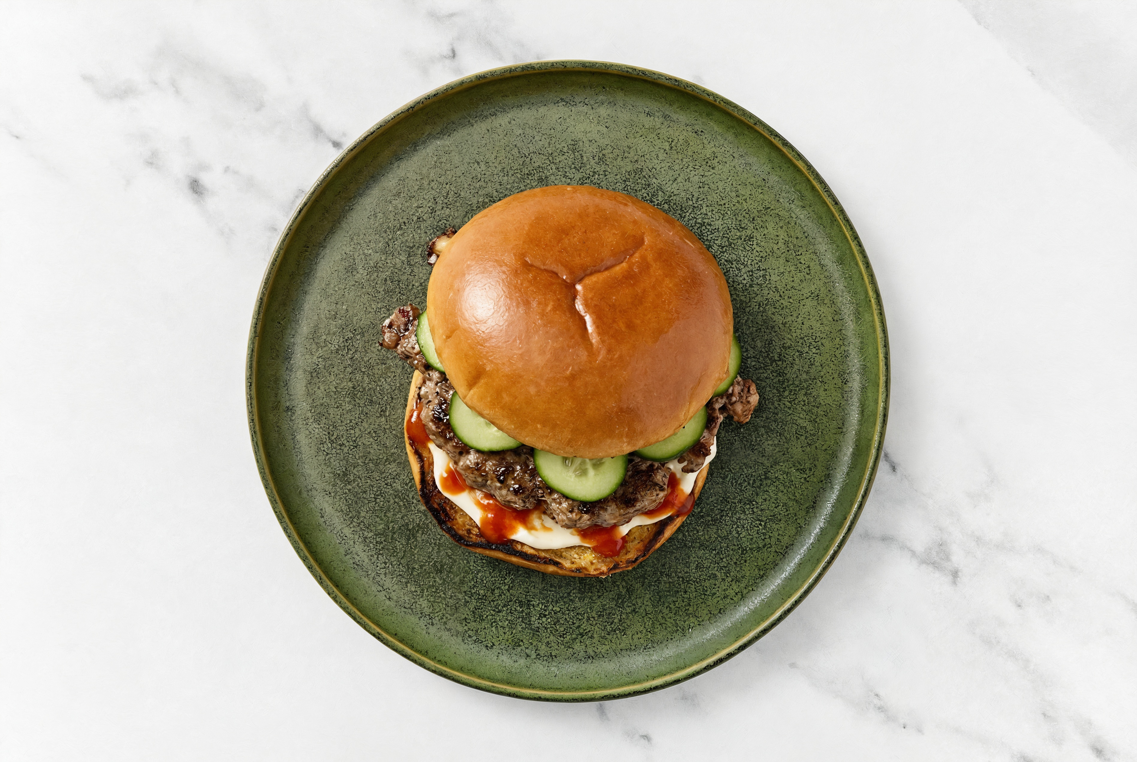 Wagyu Beef Burger on Brioche with Spicy Mayo + Cucumber with Sriracha Hot Sauce