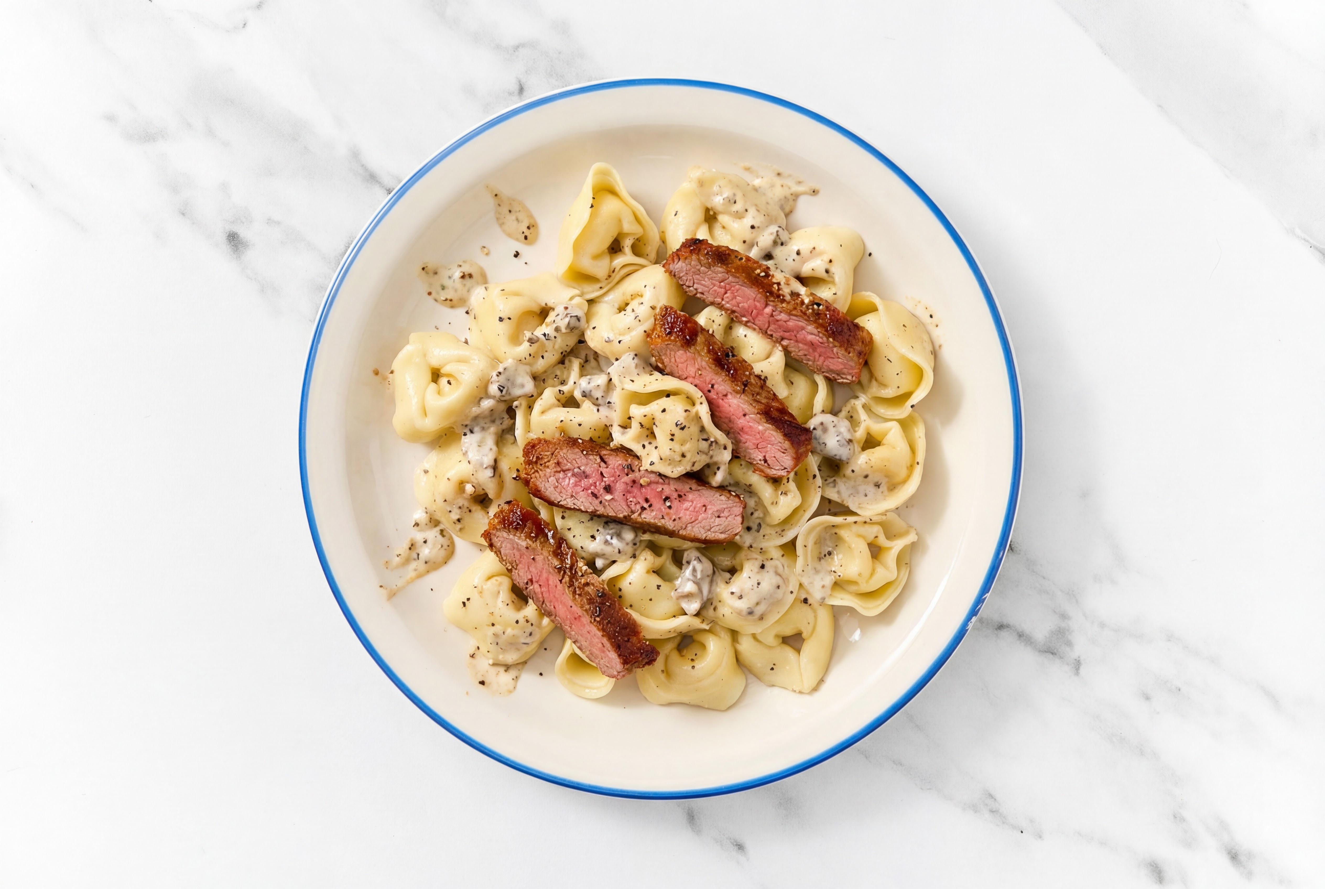 Steakhouse Tortelloni Truffle with Adobo Marinated Flank Steak