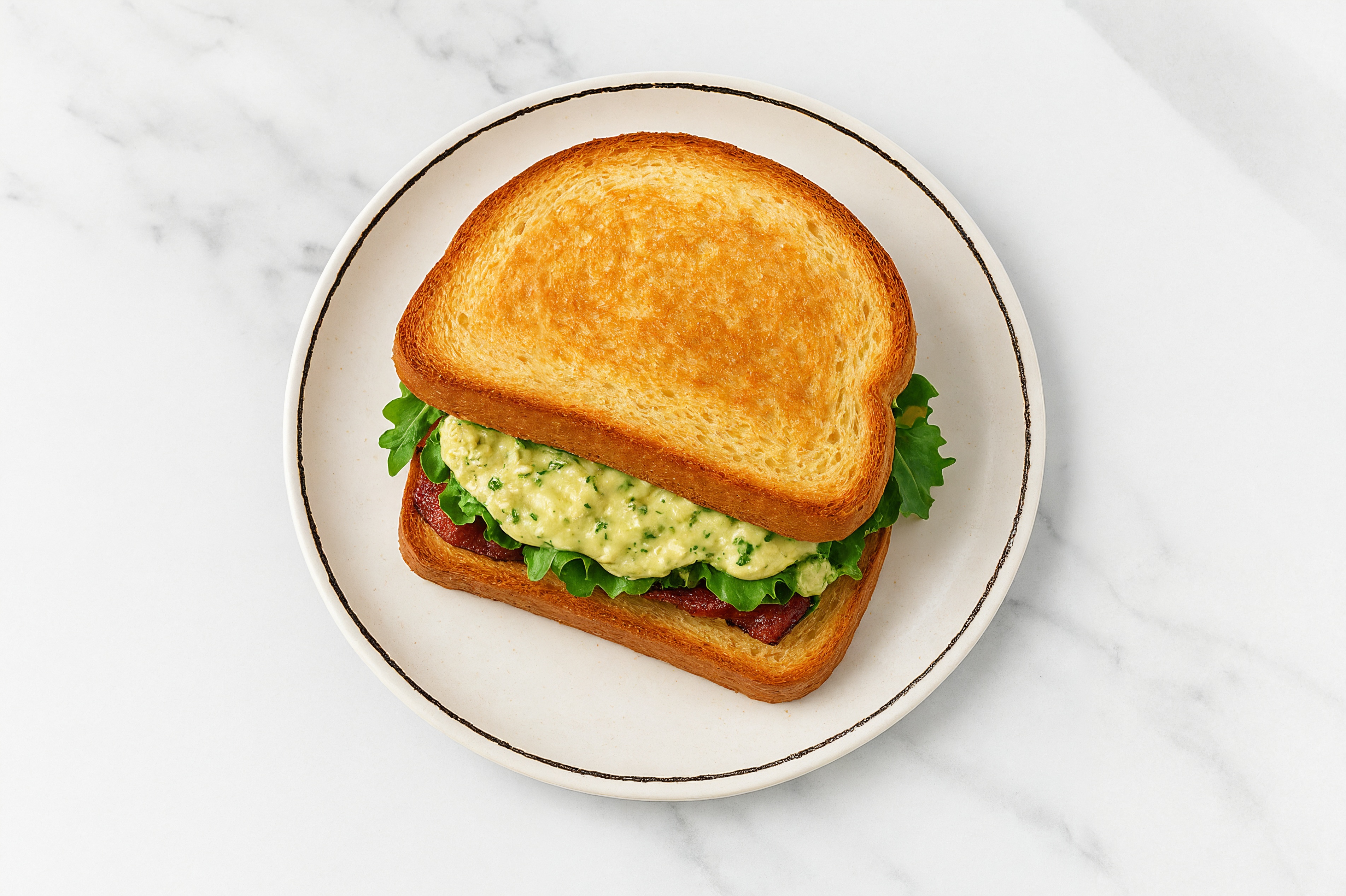 Creamy Artichoke Applewood Smoked Pork Bacon Sandwich with Spring Mix on Honey White Bread