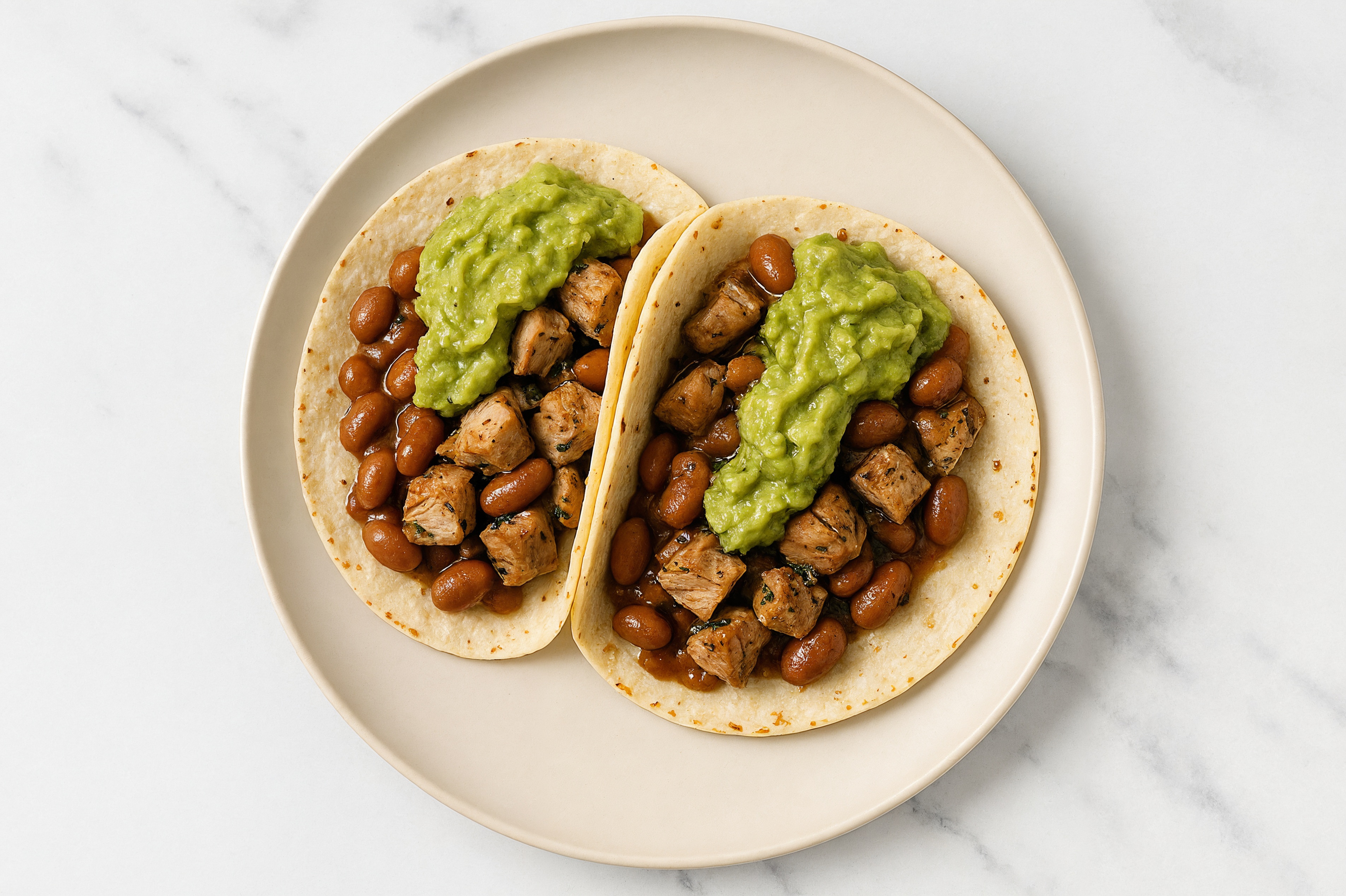 Hearty Chipotle Turkey Tacos with Guacamole & Pinto Beans