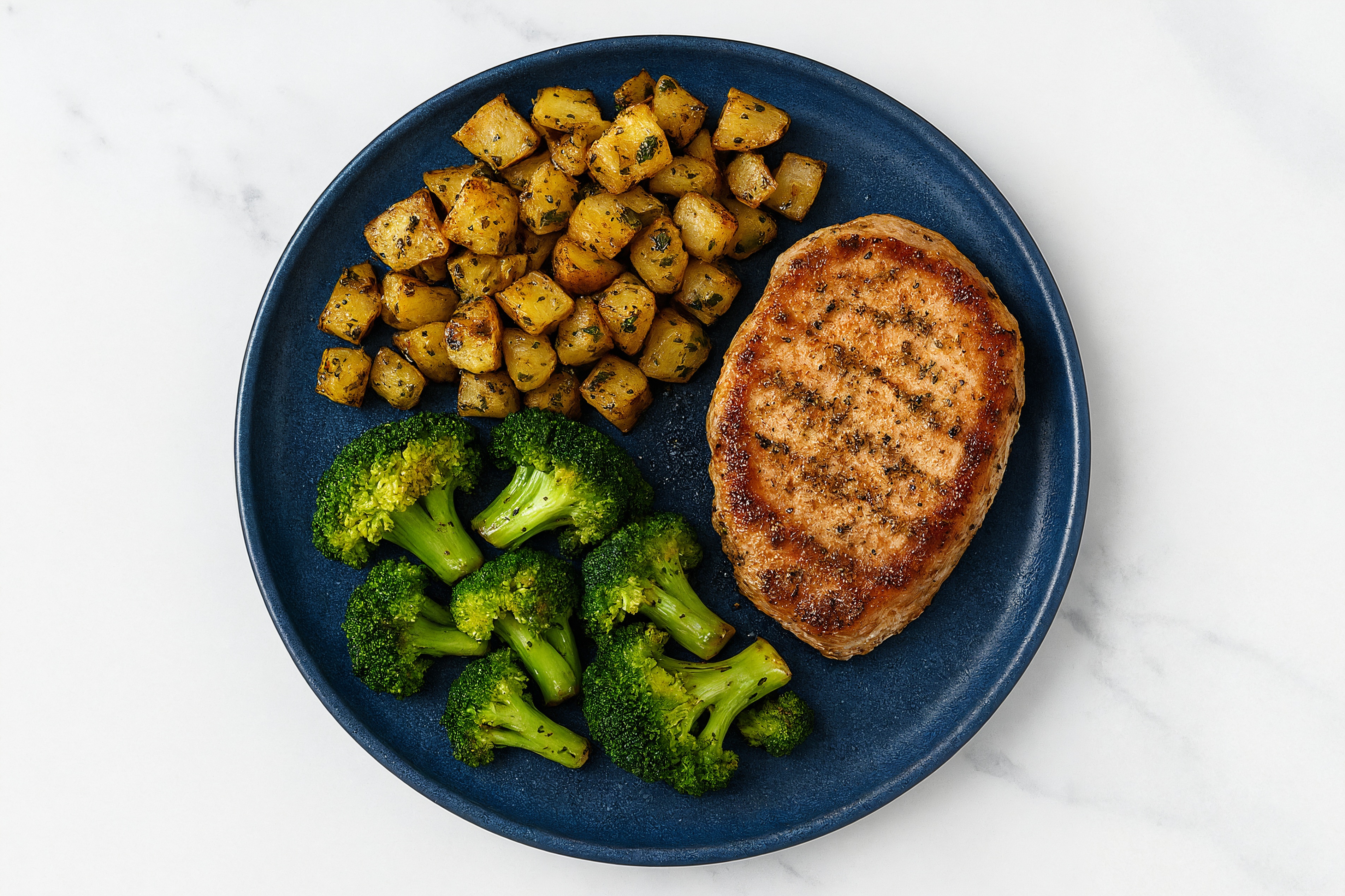 Zesty Savory Ranch Pork Chops + Herbed Potatoes with Broccoli