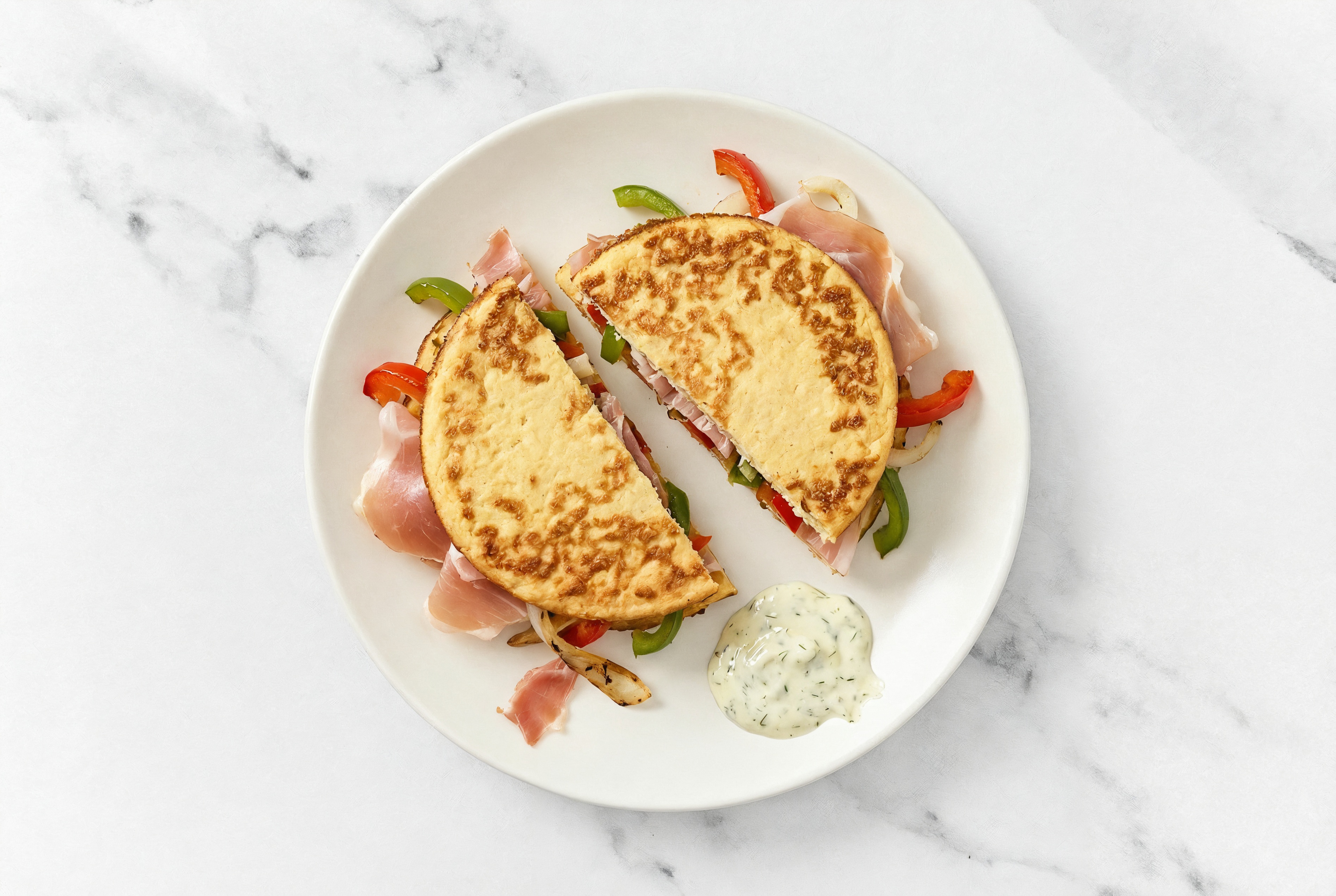 Dill Pickle Prosciutto Sandwich with Peppers + Onion on Cauliflower Rounds