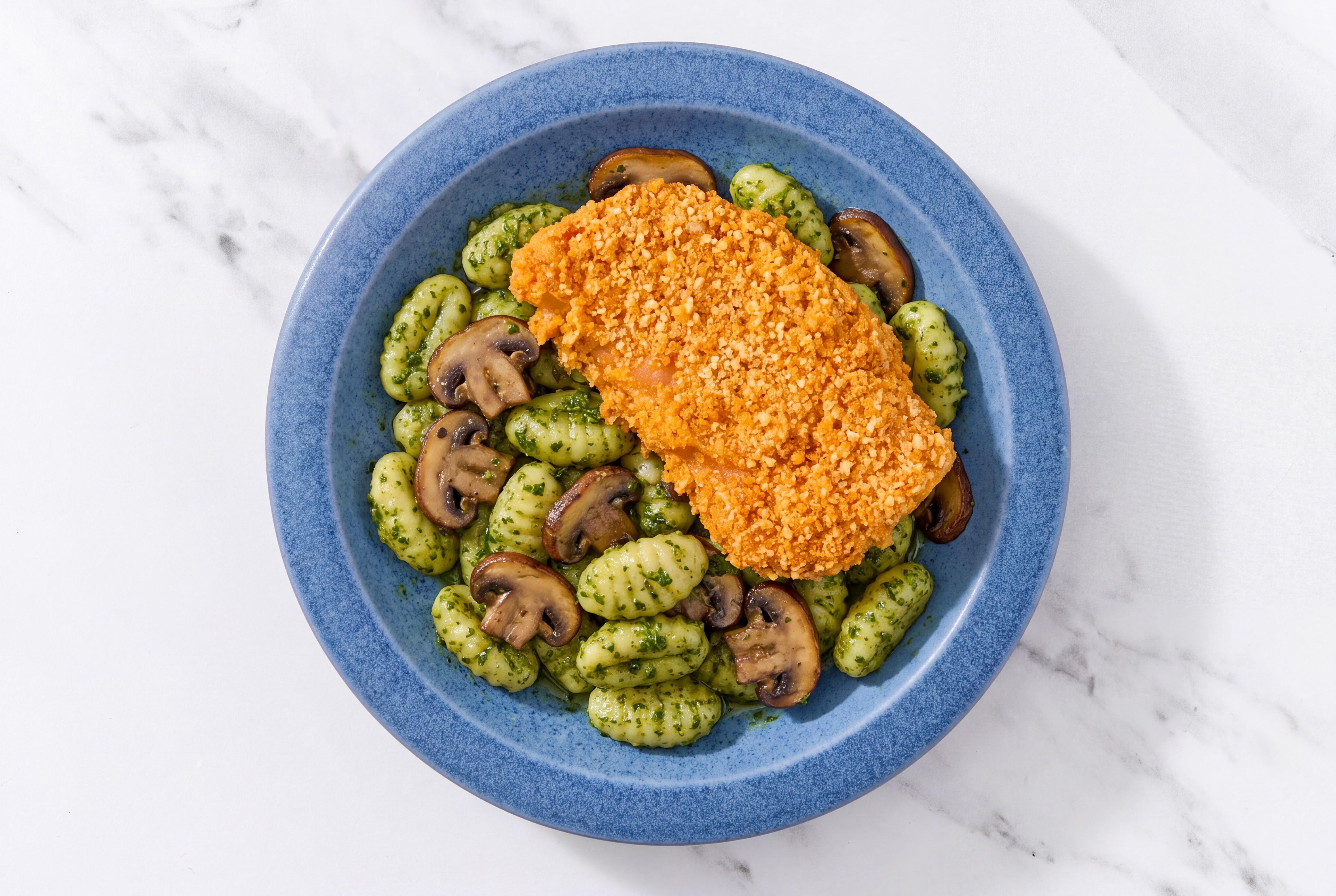 Crispy Hot Honey Chicken over Pesto Gnocchi with Baby Bella Mushrooms