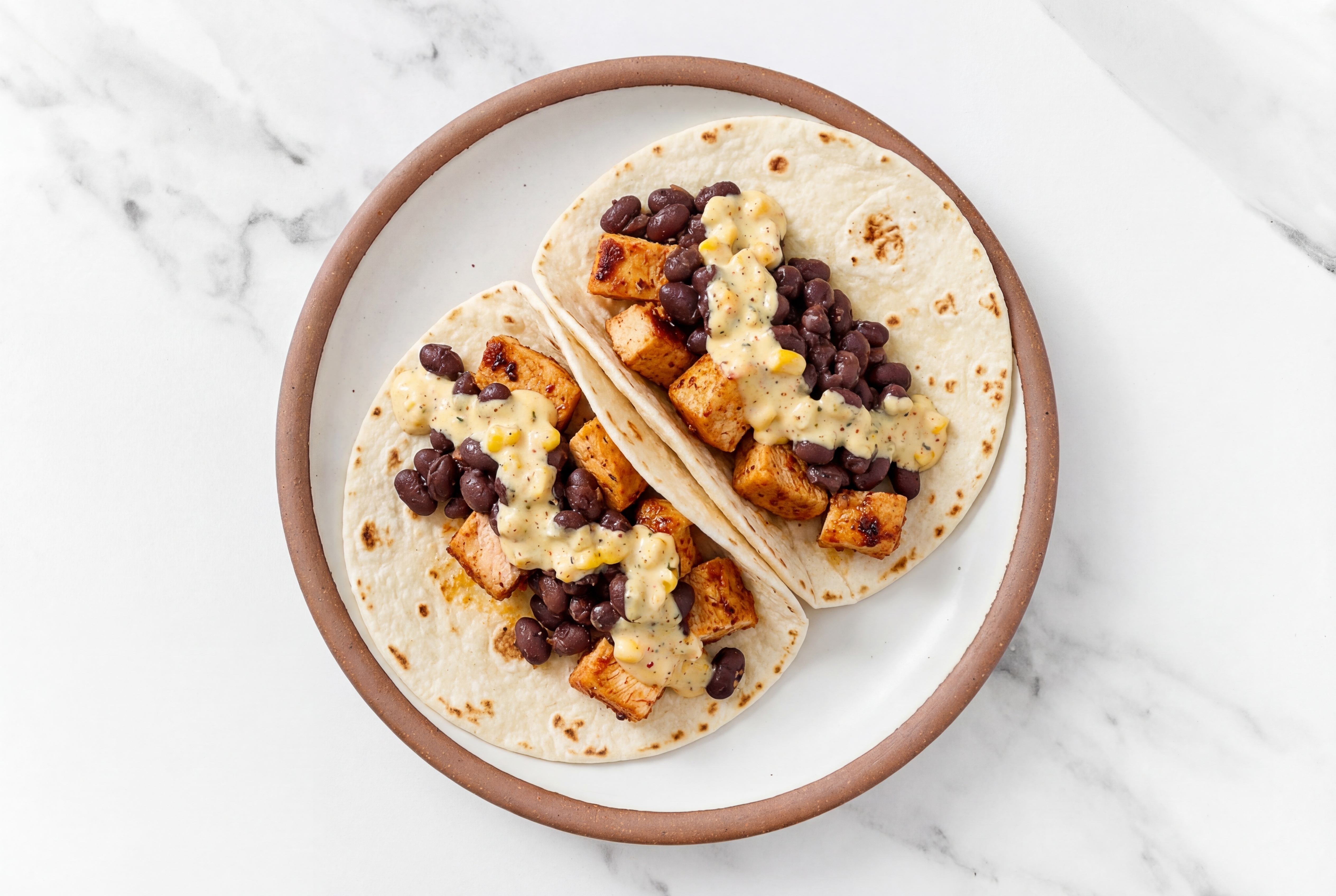  Chipotle Chicken Tacos with Street Corn Sauce & Spiced Beans