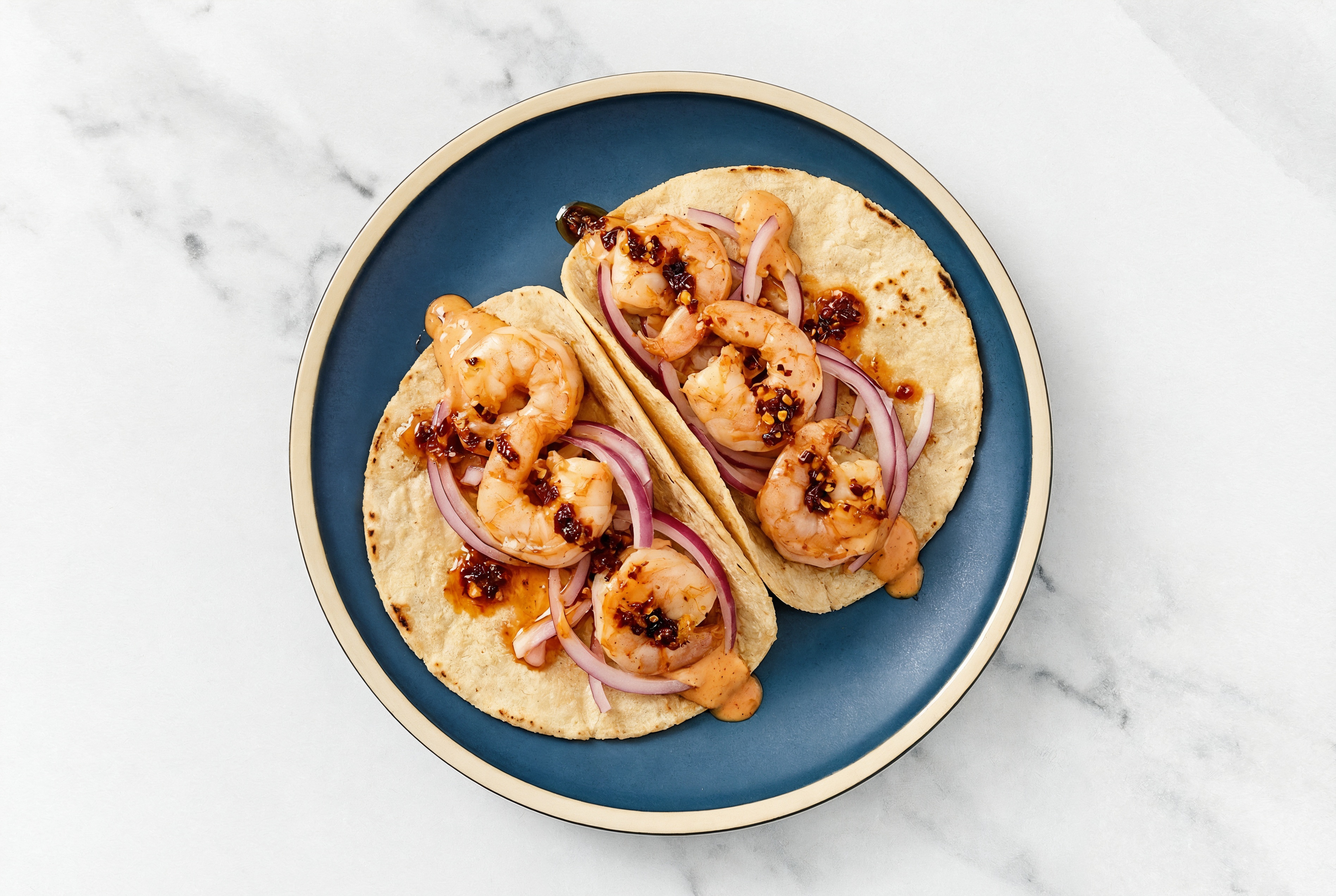 Hearty Bang Shrimp Tacos with Red Onion