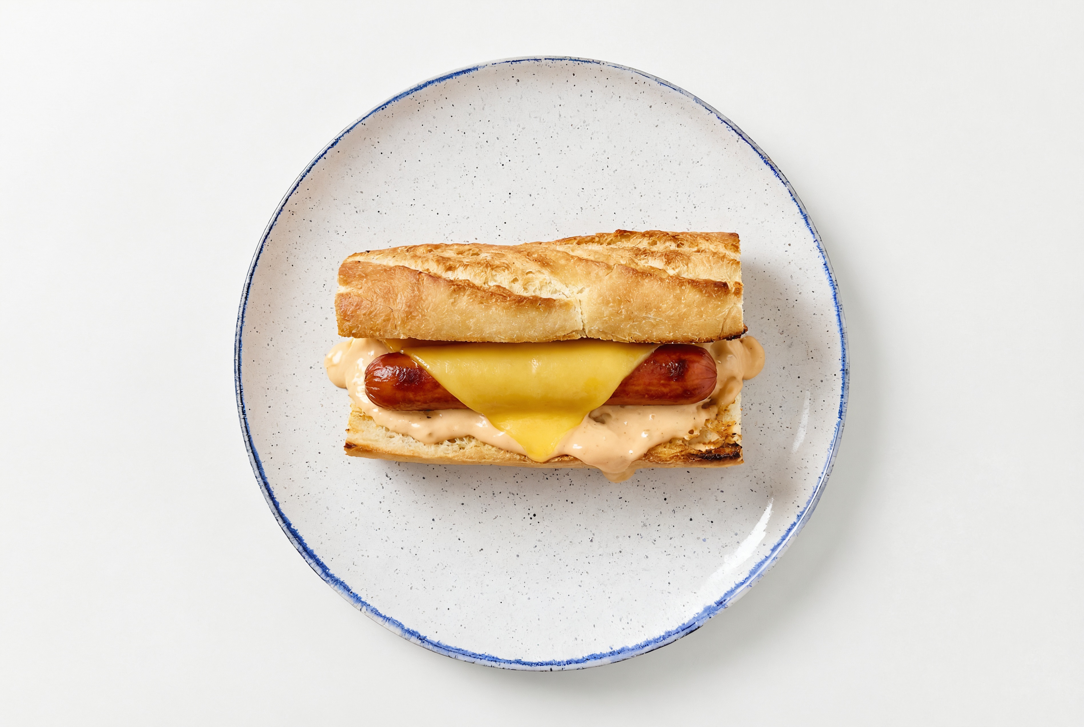 Vegan Cheddar Beef Hot Dog with Awesome Sauce on Baguette