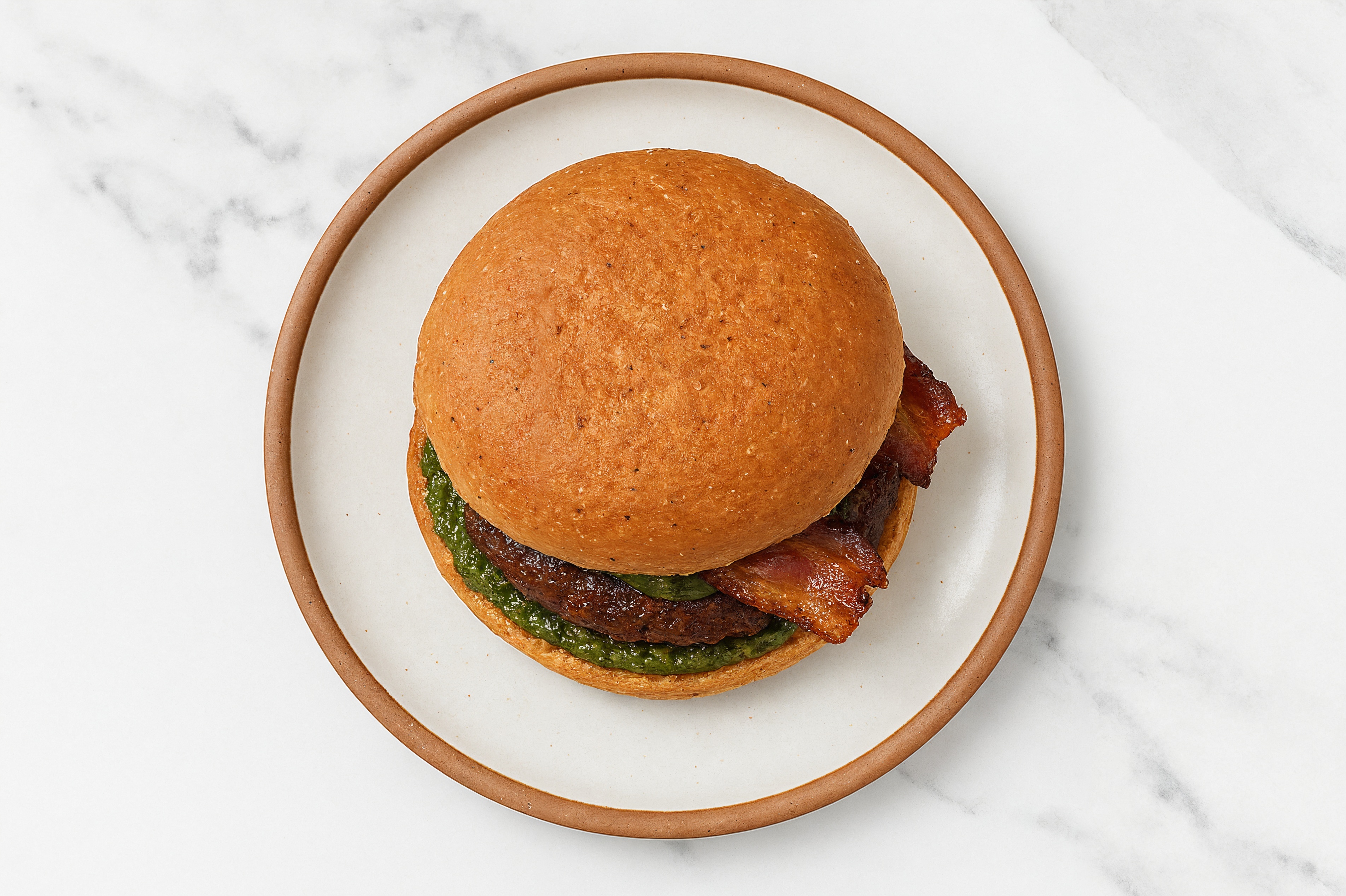 Bison Burger on Sprouted Grain with Spinach Pesto & Applewood Smoked Pork Bacon