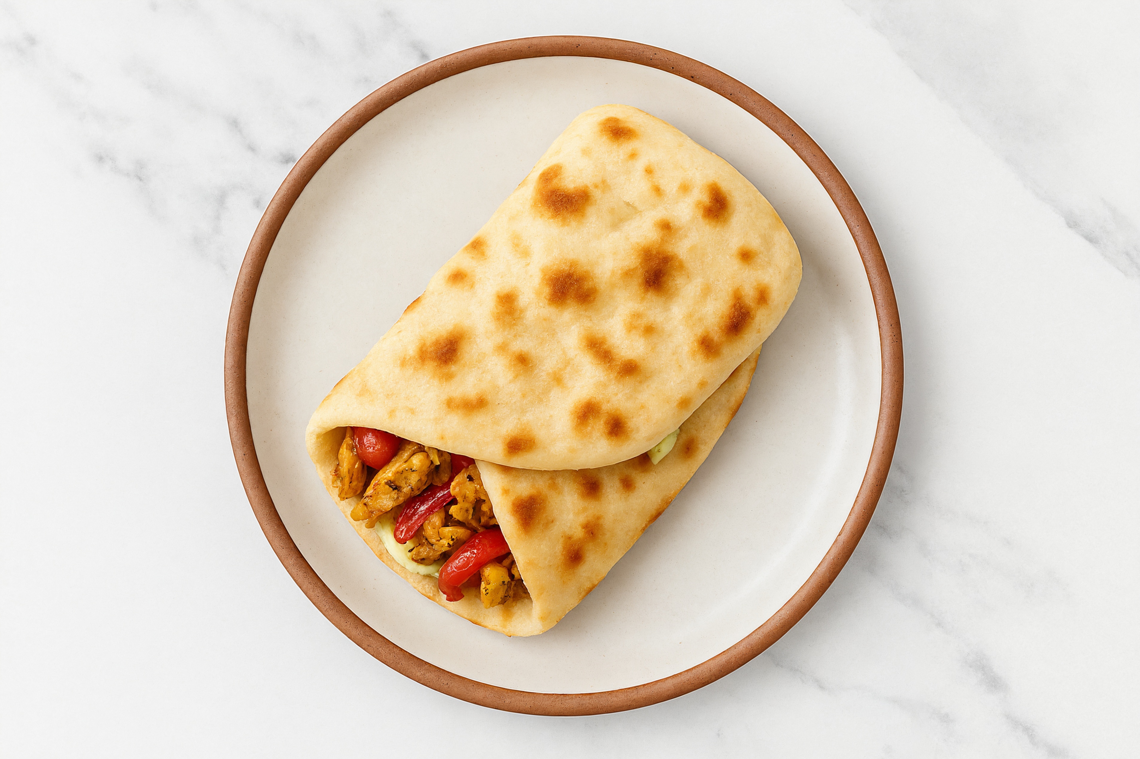 Shawarma Chicken Wrap with Jalapeño Crema + Pickled Onions