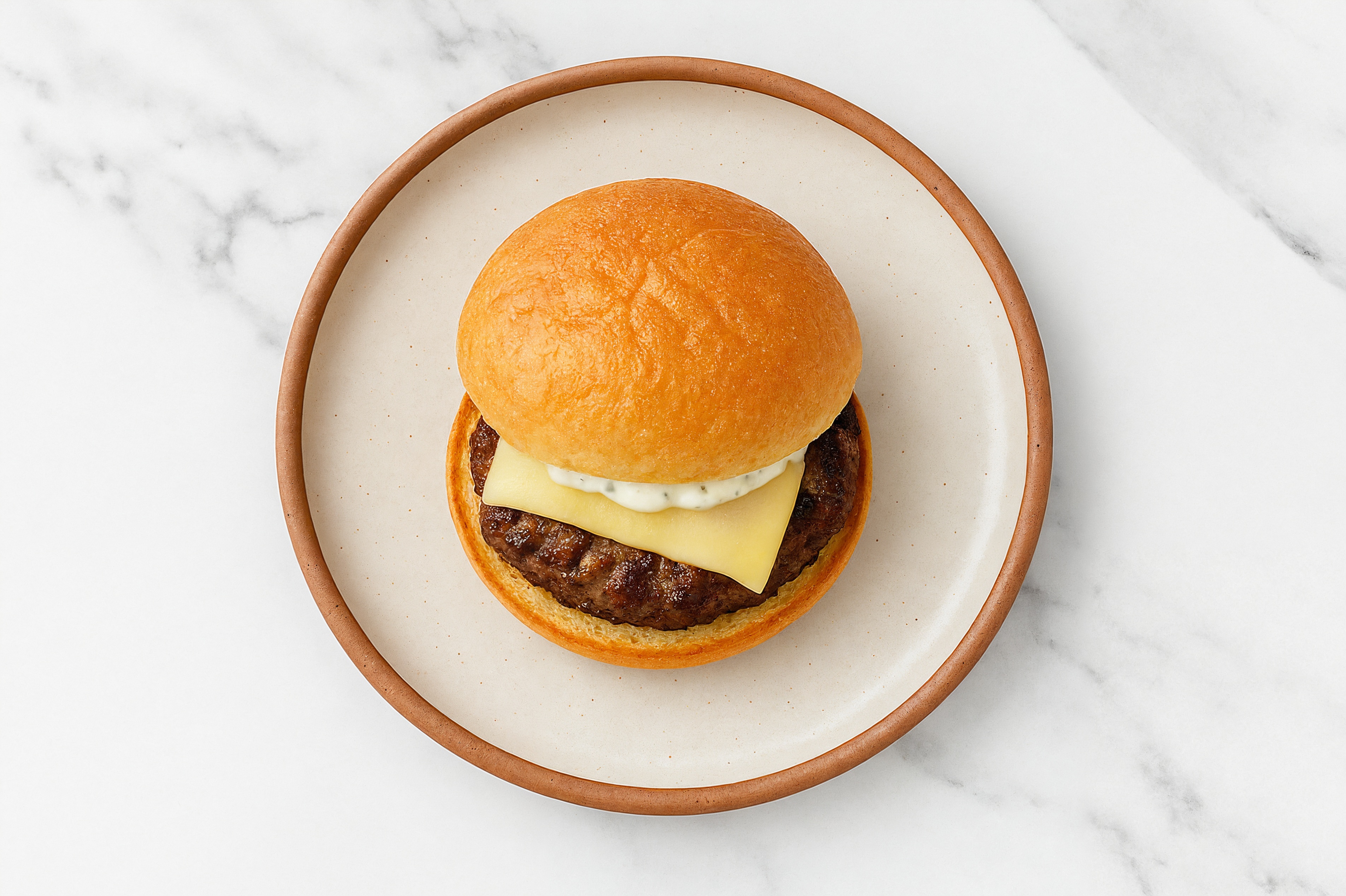 Lamb Burger on Gluten-Free Bun with Tzatziki & Swiss