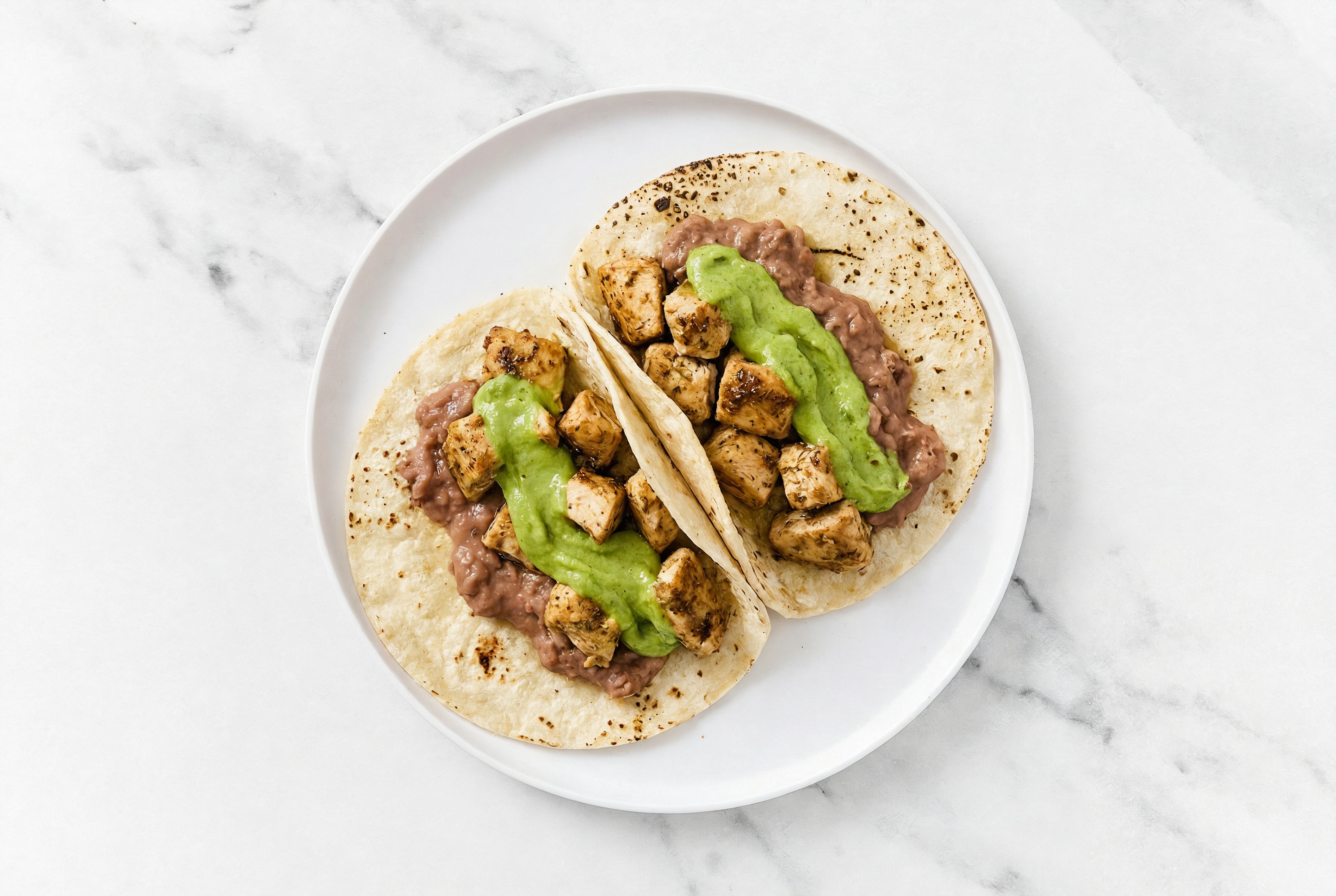 Hearty Garlic Chicken Tacos with Avocado & Refried Red Beans