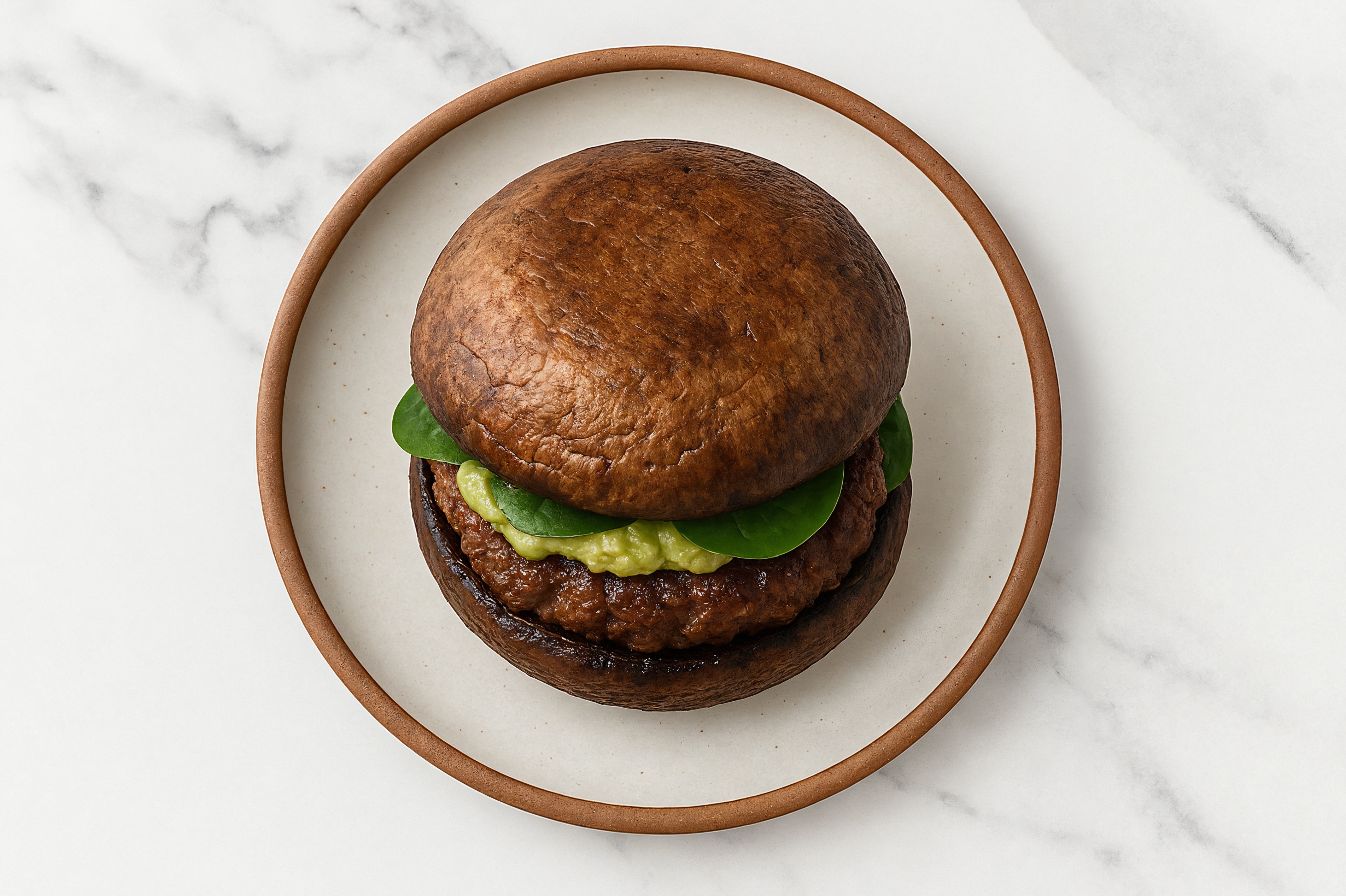 Guacamole Bison Burger on Mushroom Bun with Baby Spinach