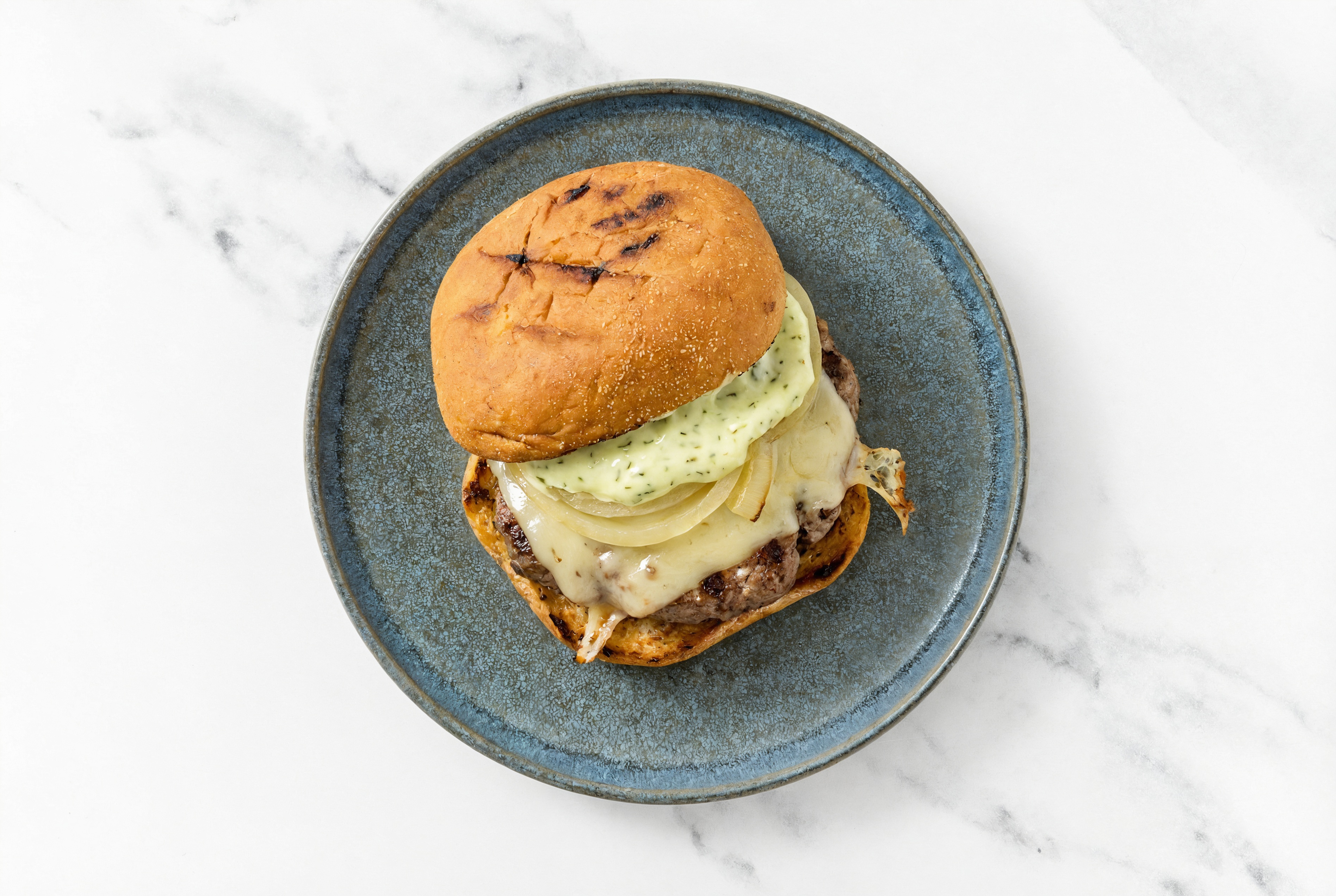 Herby Bison Burger with Vegan Jalapeño Crema + Havarti
