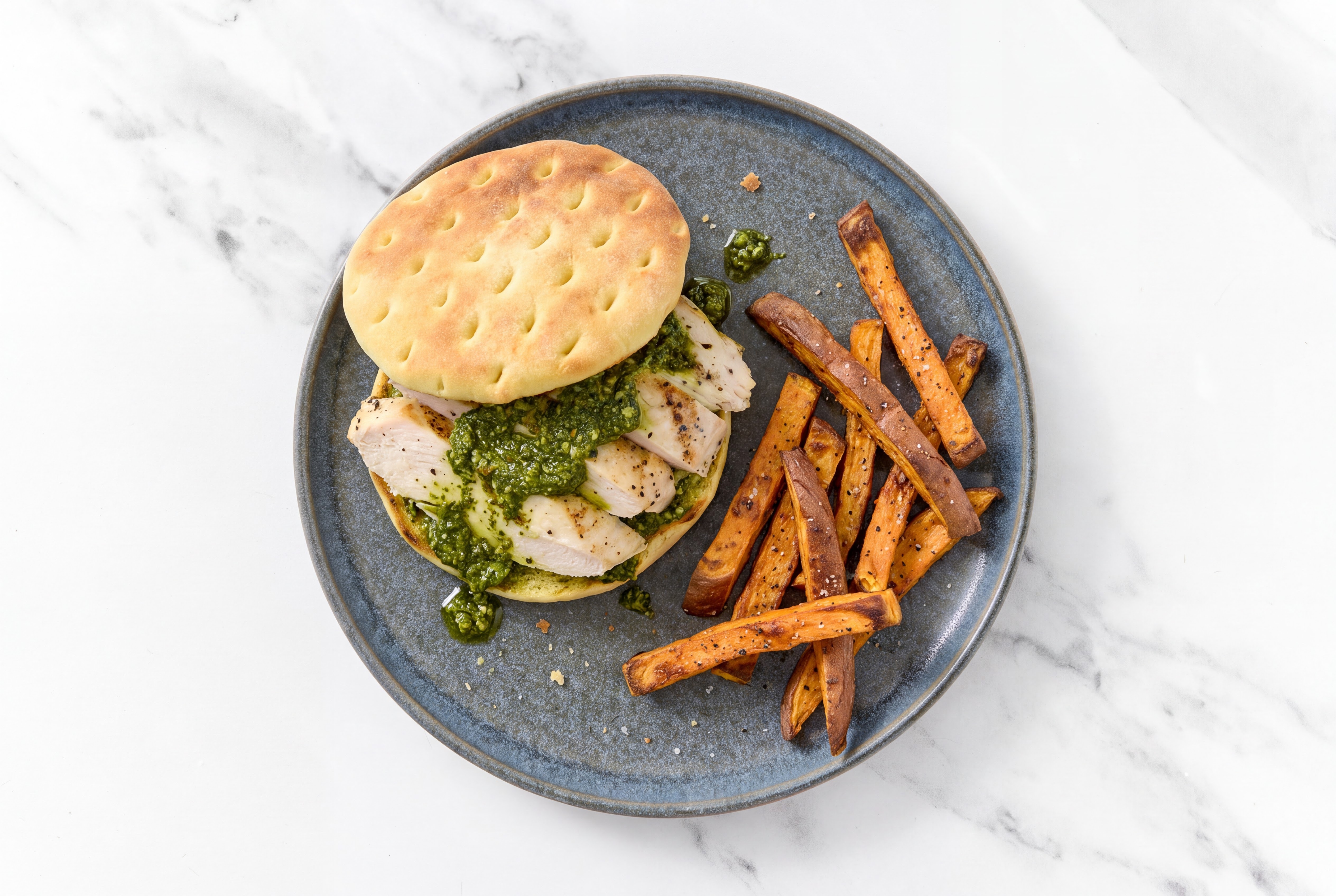 Savory Pesto Seasoned Grilled Chicken Breast Sandwich with Sweet Potato Fries