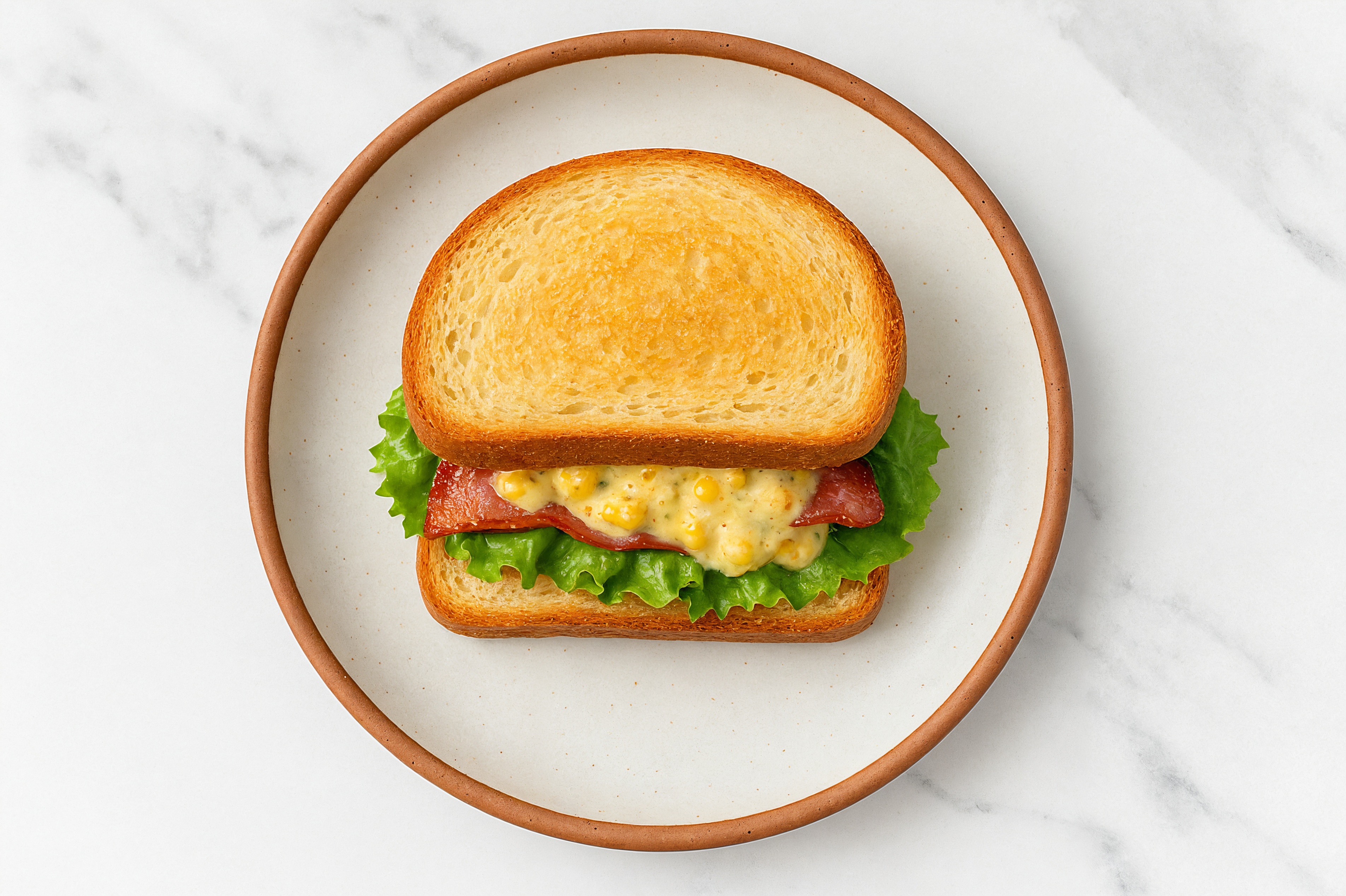 Street Corn Turkey Bacon Sandwich with Green Leaf Lettuce on Honey White Bread
