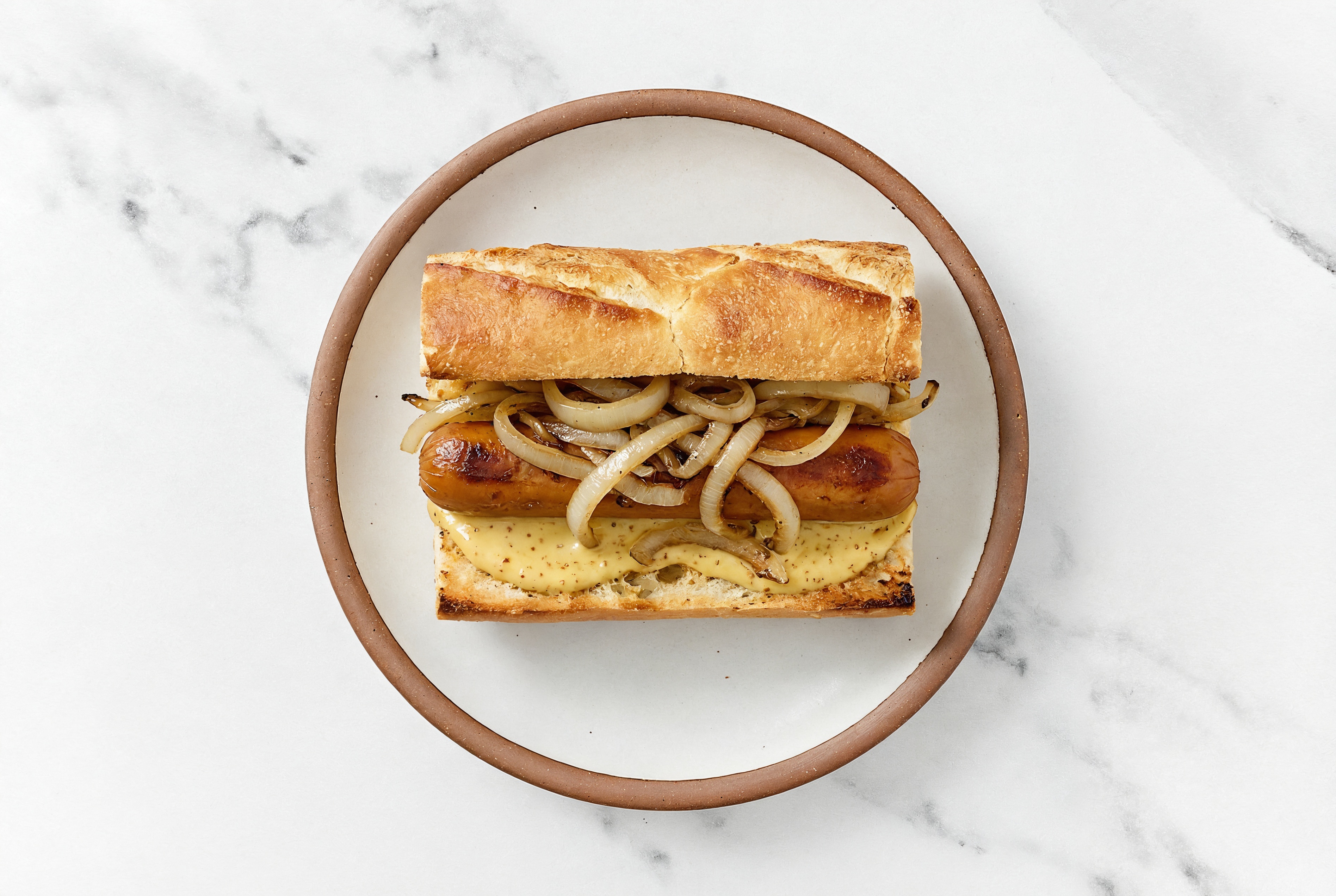 Carmelized Onion Smart Dog with Honey Mustard on Baguette