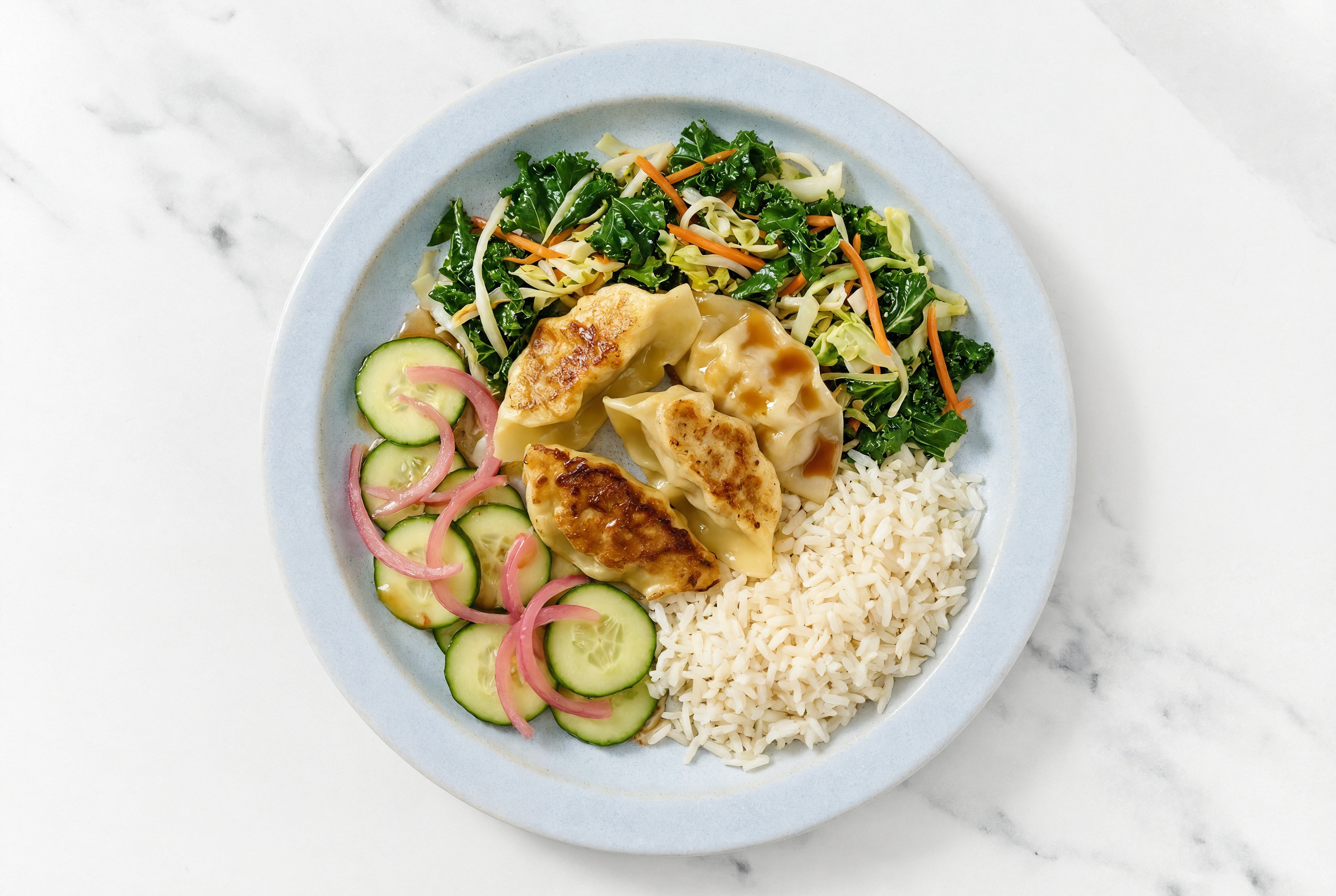 Sesame Chicken Ginger Fried Dumplings + Pickled Red Onions Cucumber Grain Bowl