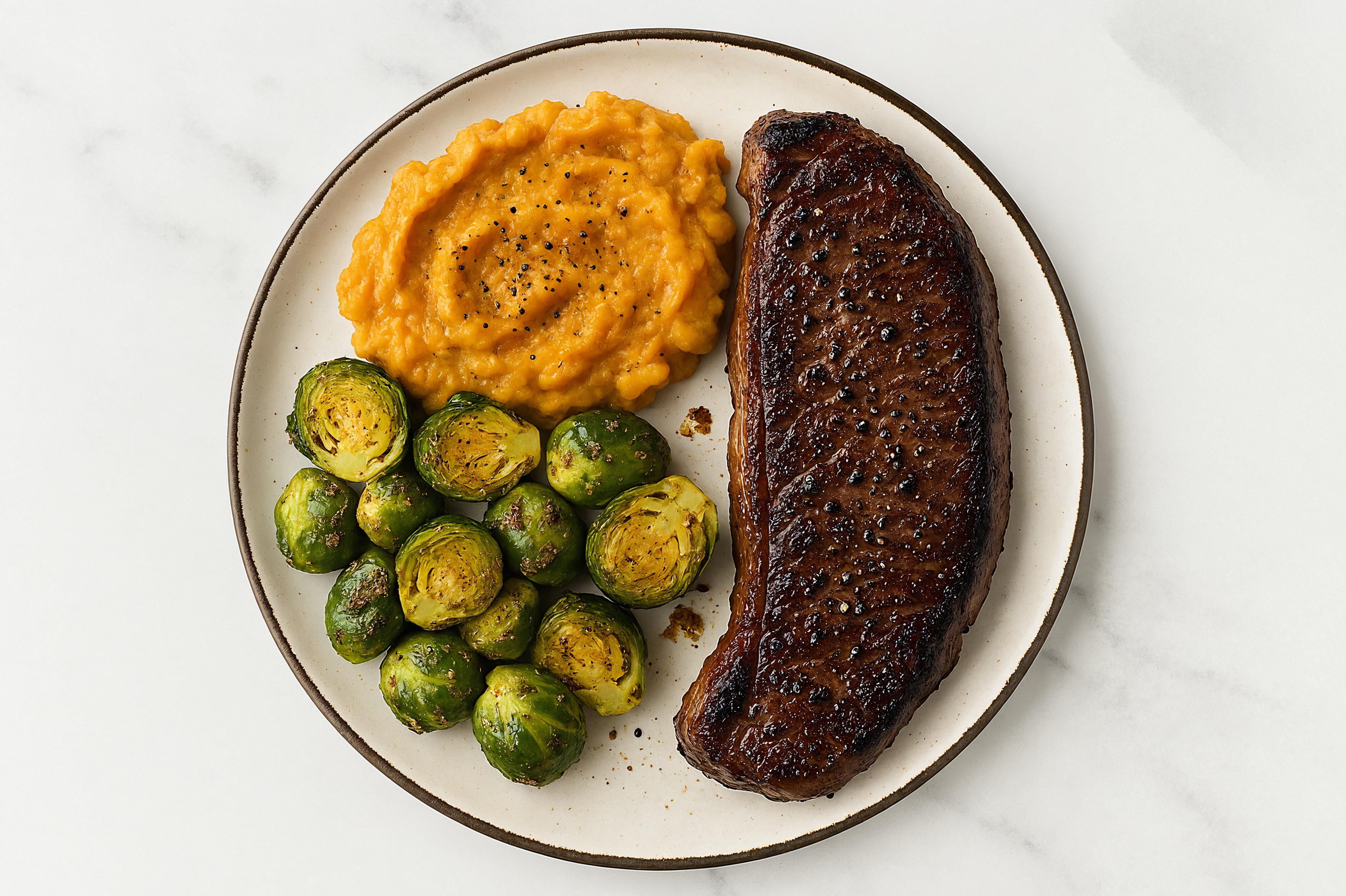 Seared Wagyu Strip Steak + Honey Herb Roasted Brussels