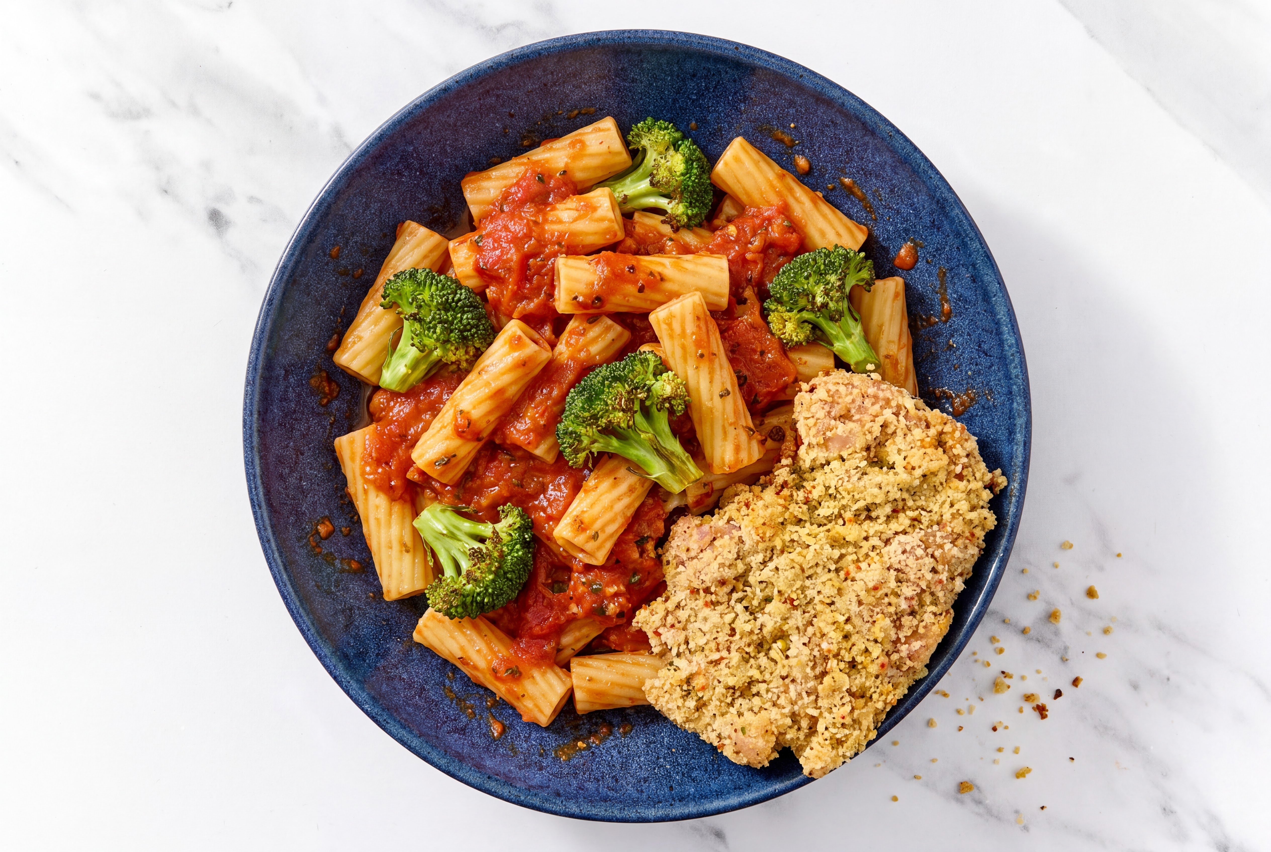 Crispy Garlic Chicken over Marinara Rigatoni with Broccoli