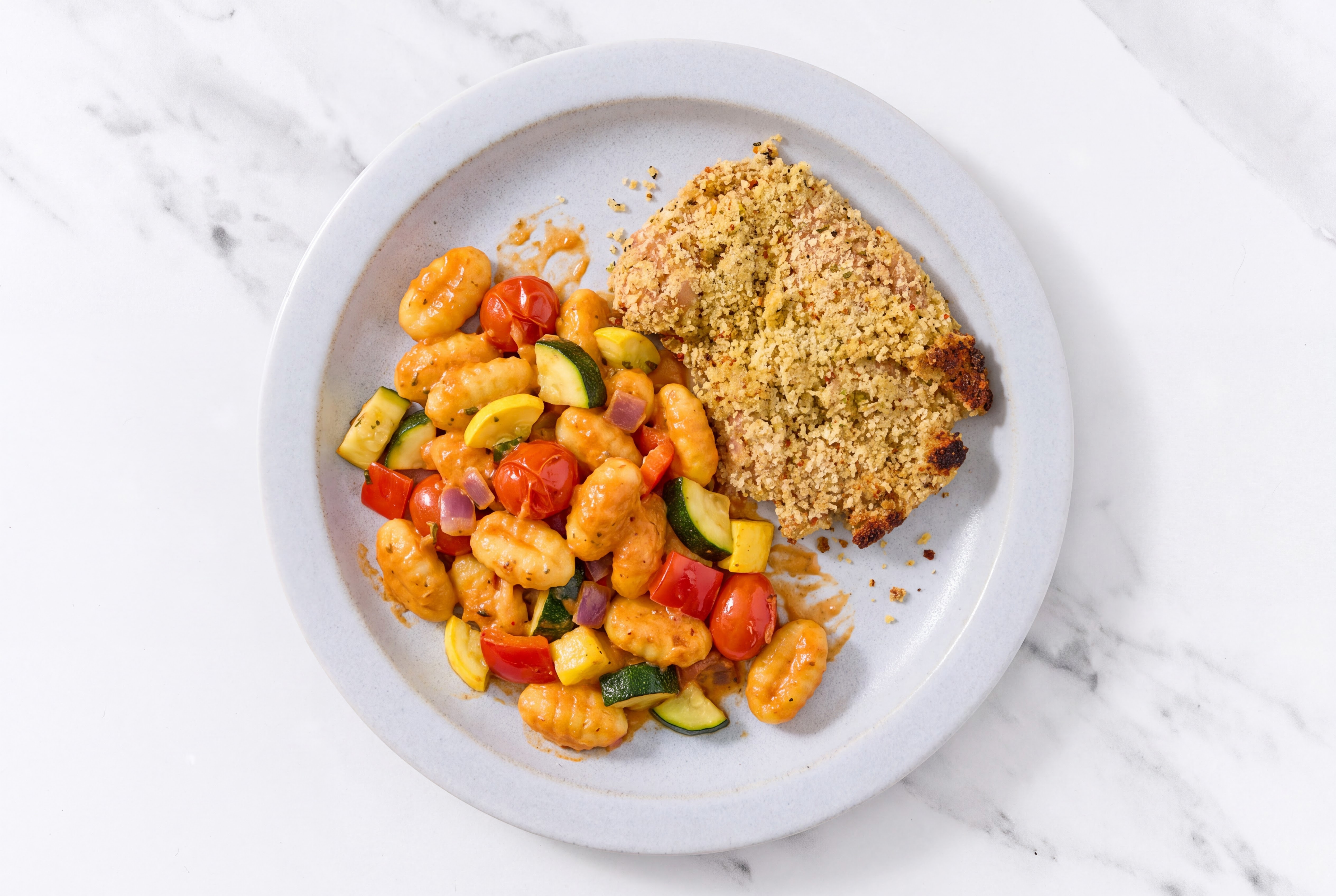 Crispy Garlic Chicken over Creamy Vodka Gnocchi with Mixed Veggies