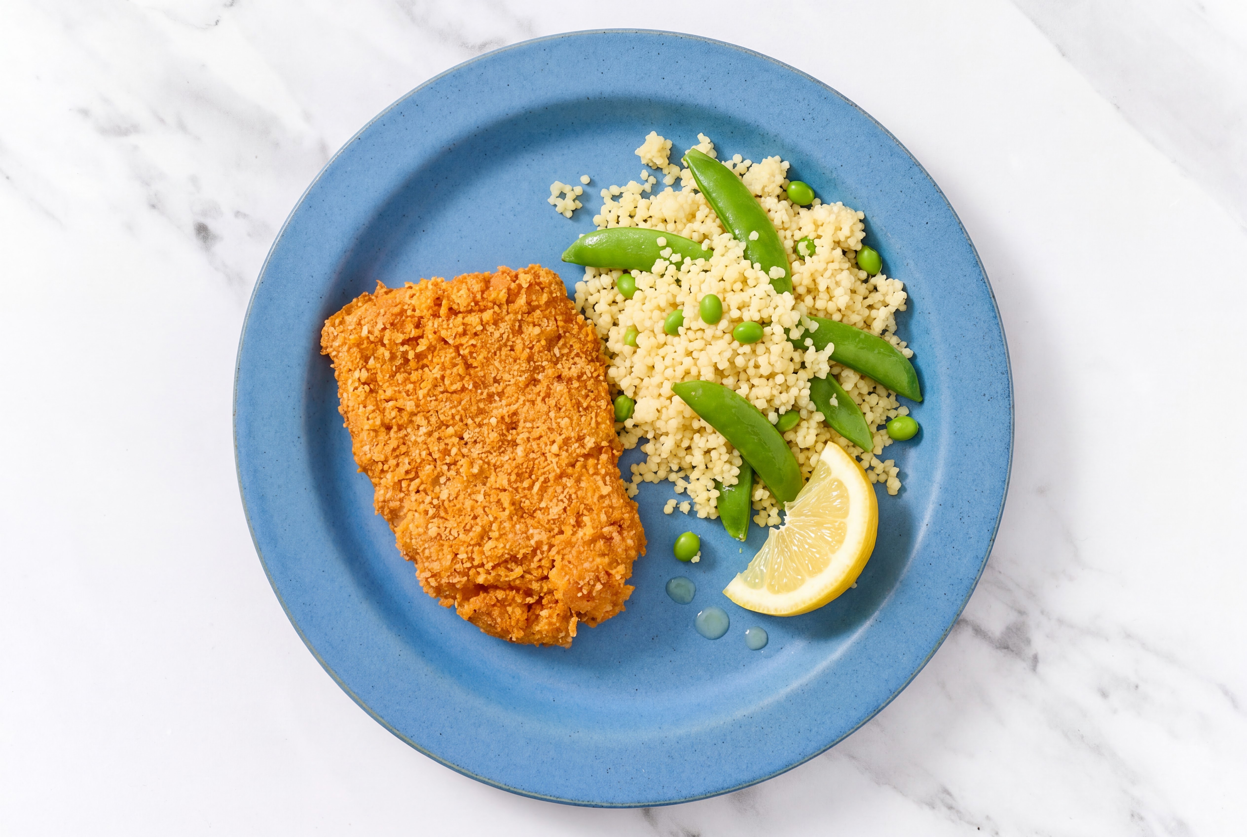 Lemon Hot Honey Breaded Chicken Cutlet with Snap Peas & Couscous