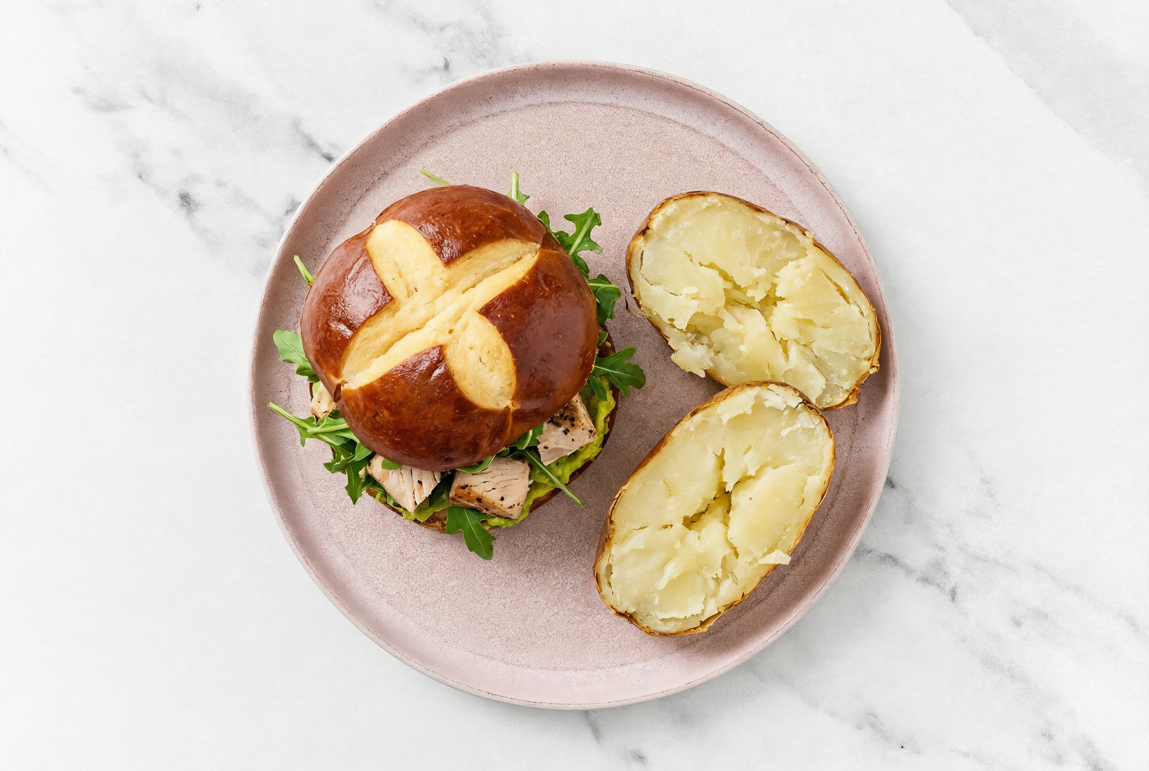 Guac' Tuna Sandwich on Pretzel Bun with Arugula + Russet Potato