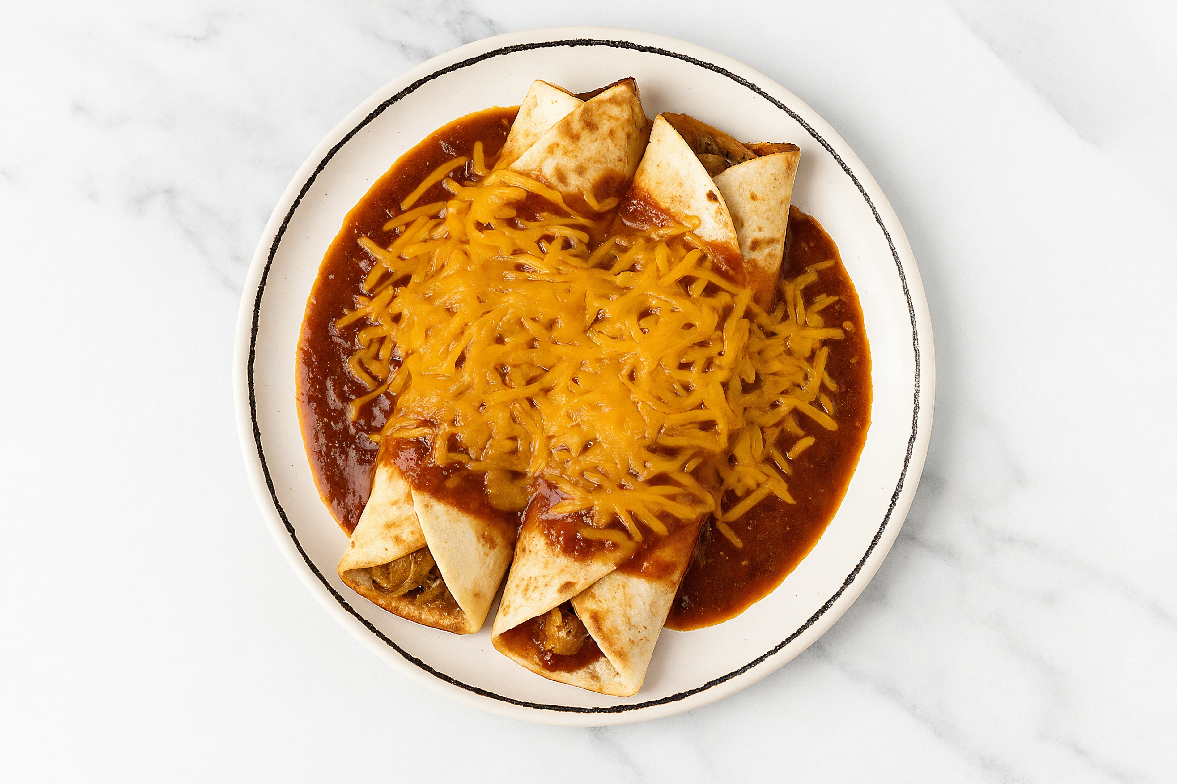 Bright Cheesy Pulled Chicken Enchiladas Rojas with Shredded Sharp Cheddar Cheese